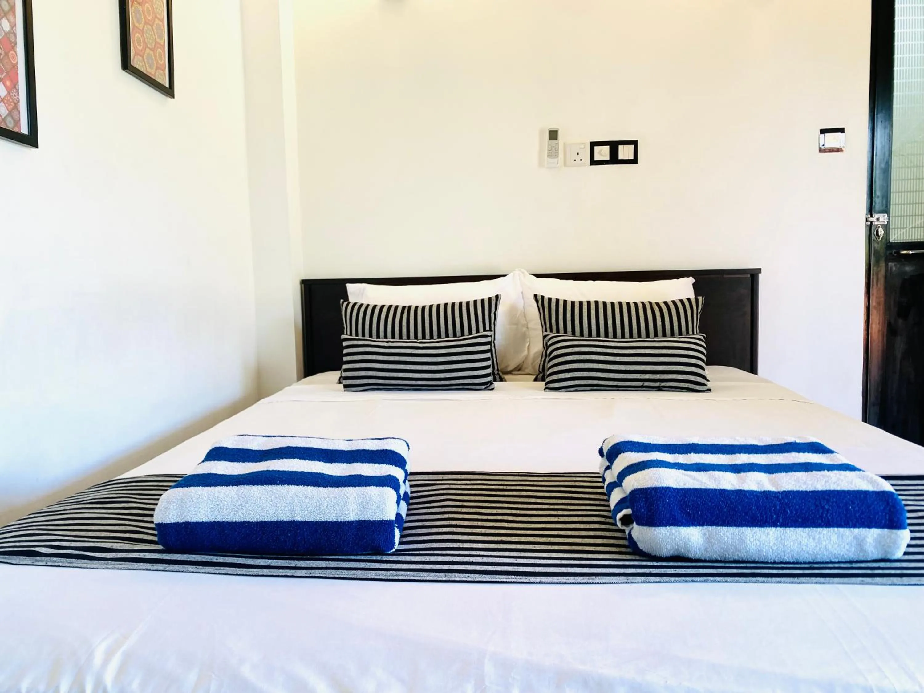 Bed in Coco Palm Villa and Cabanas