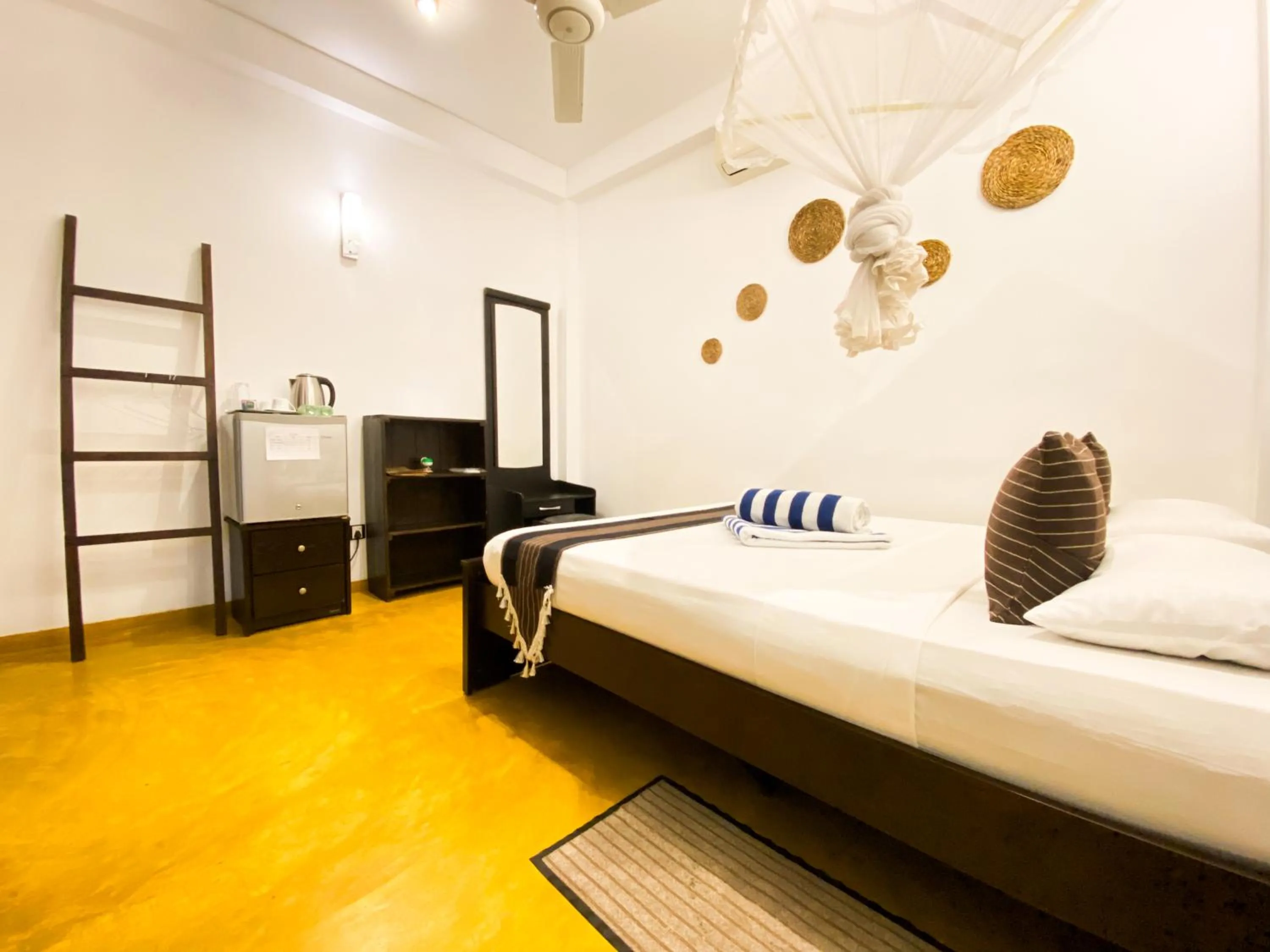 Bed in Coco Palm Villa and Cabanas