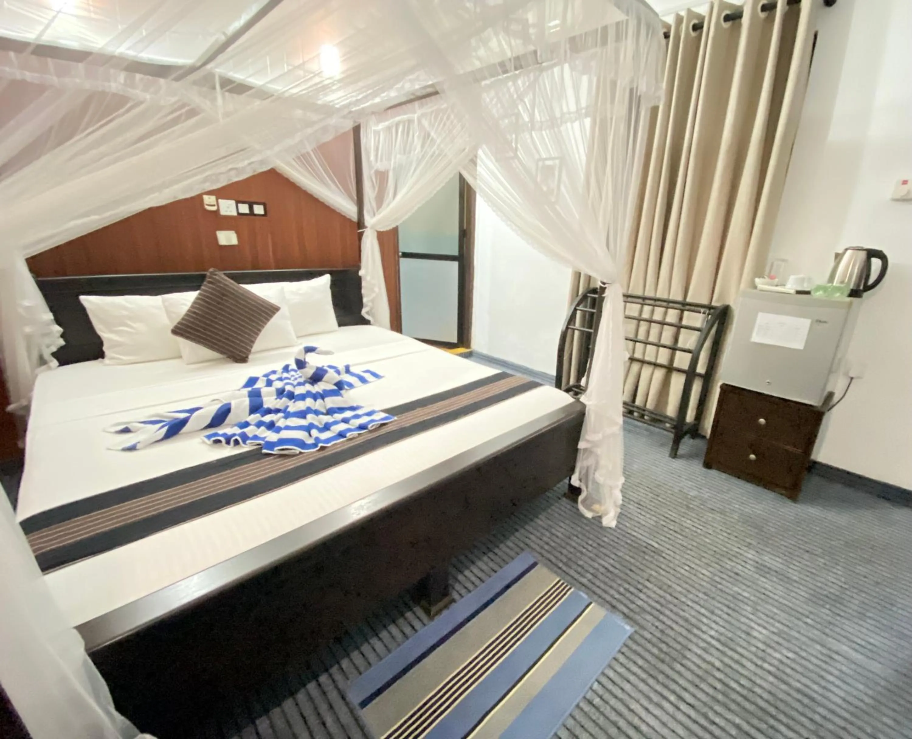 Bed in Coco Palm Villa and Cabanas