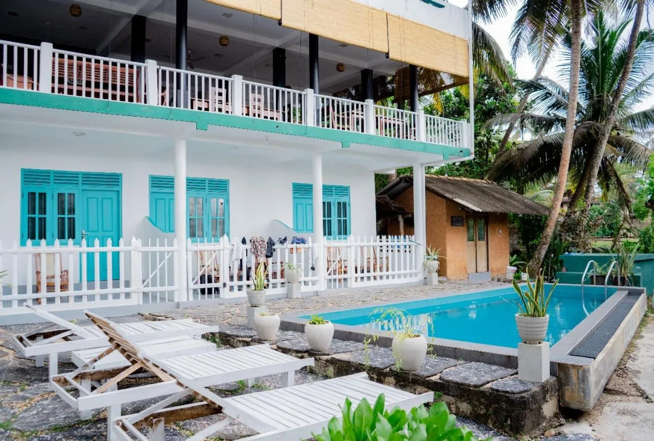 Property building in Asanka Surf House & Restaurant with pool