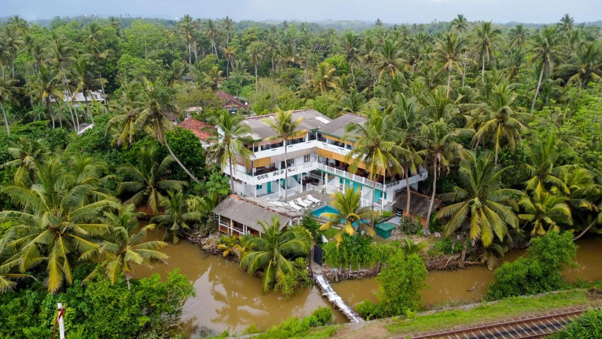 Property building in Asanka Surf House & Restaurant with pool