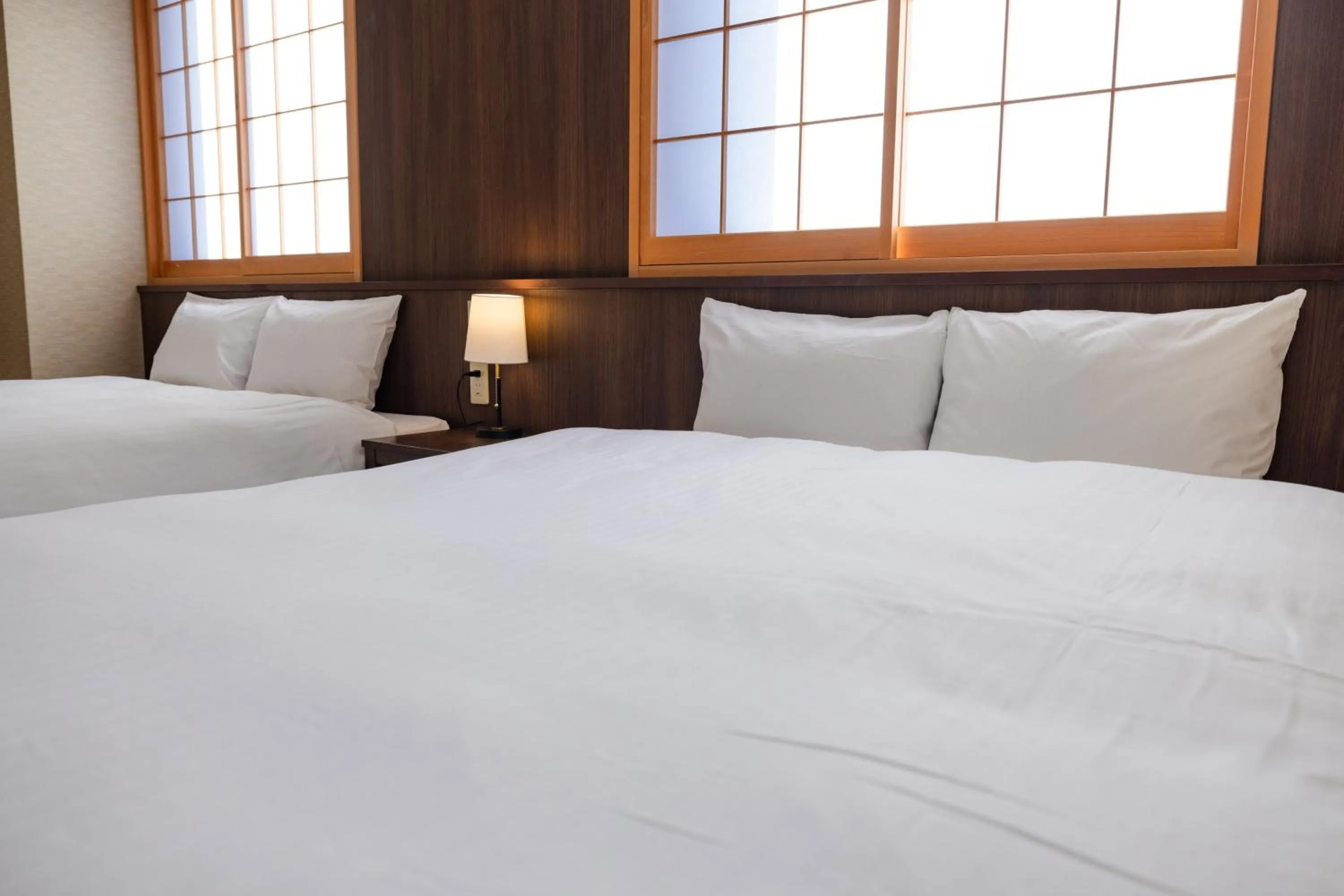 Bed in Hotel Takasago