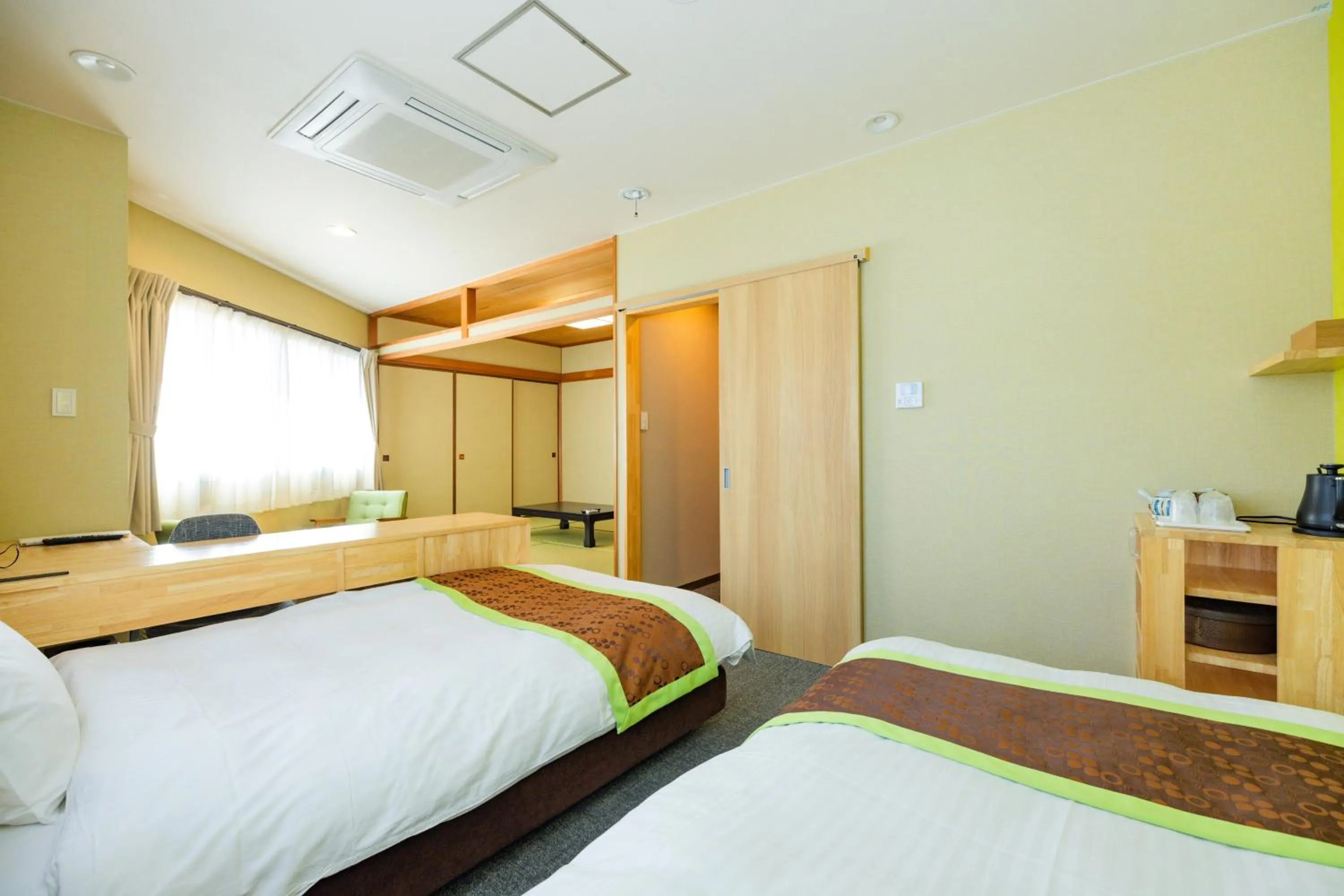 Bed in Hotel Takasago