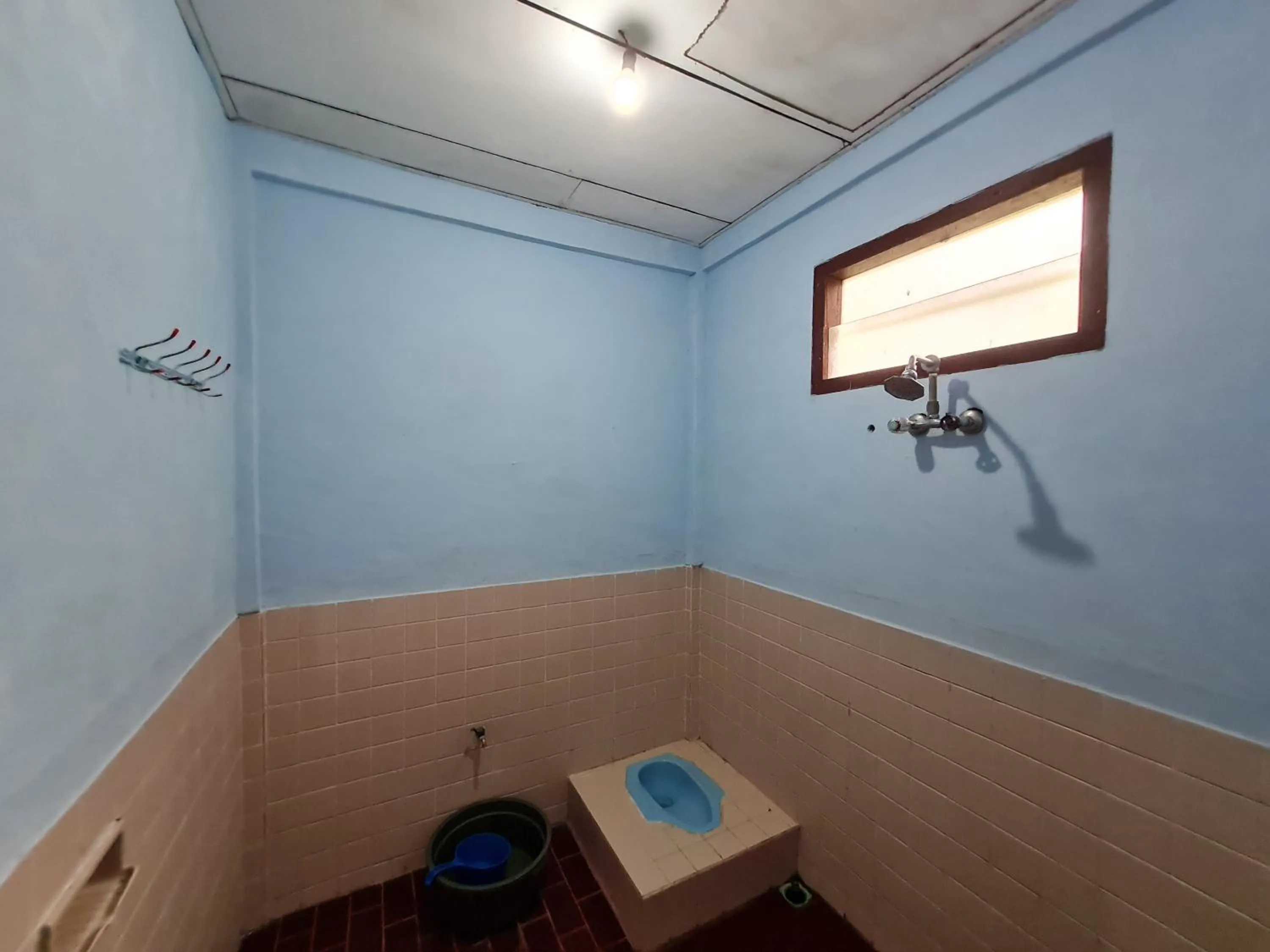 Toilet in Abadi Guest House