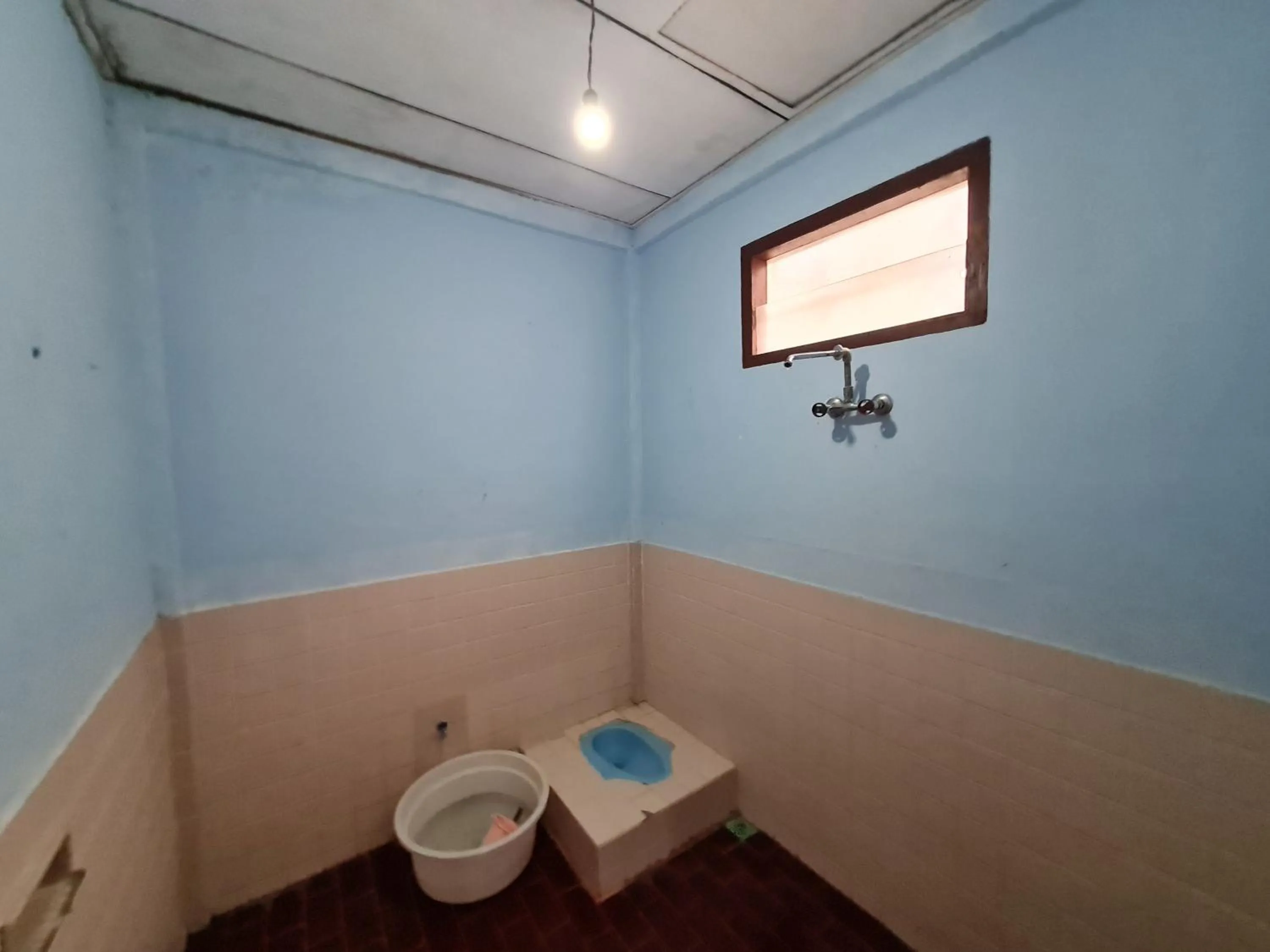 Toilet in Abadi Guest House