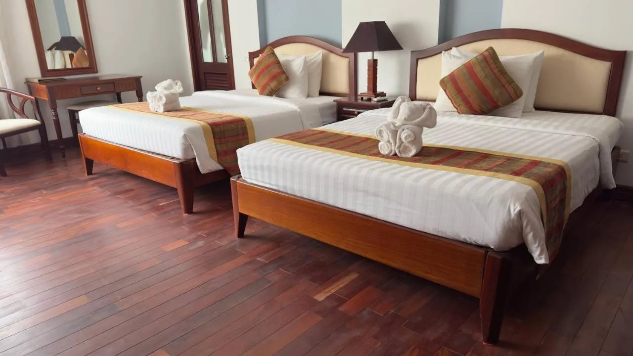 Bed in EG Paradise Angkor Villa Hotel