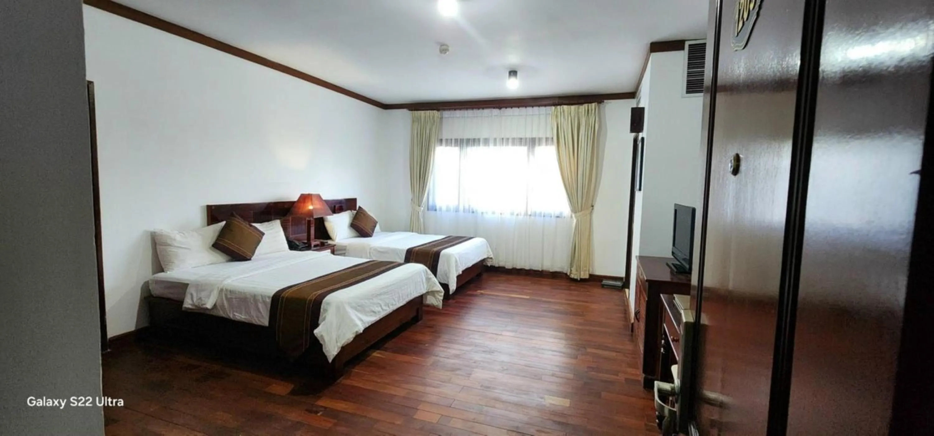 Photo of the whole room, Bed in EG Paradise Angkor Villa Hotel