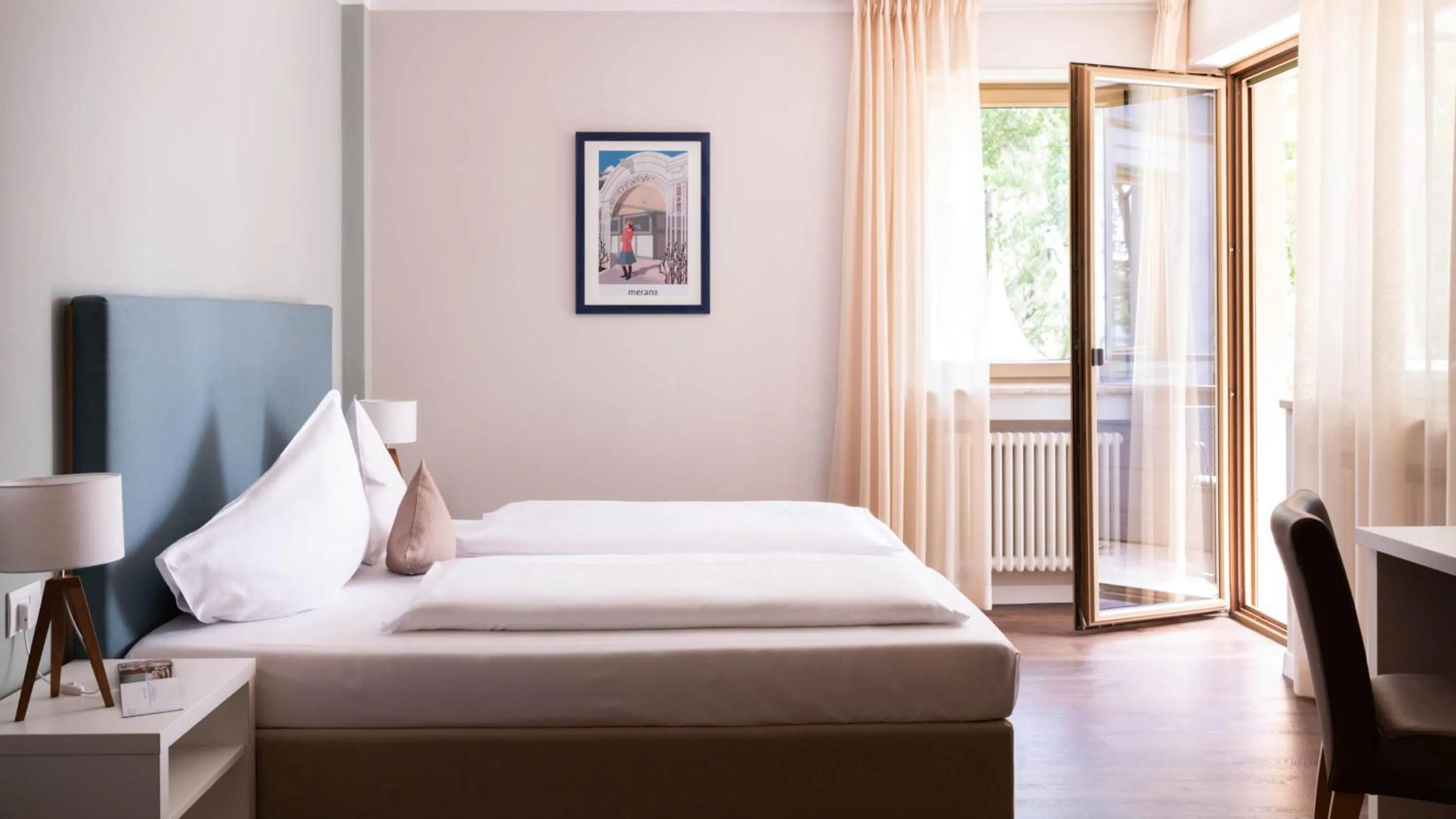 Bed in Flora Hotel & Suites