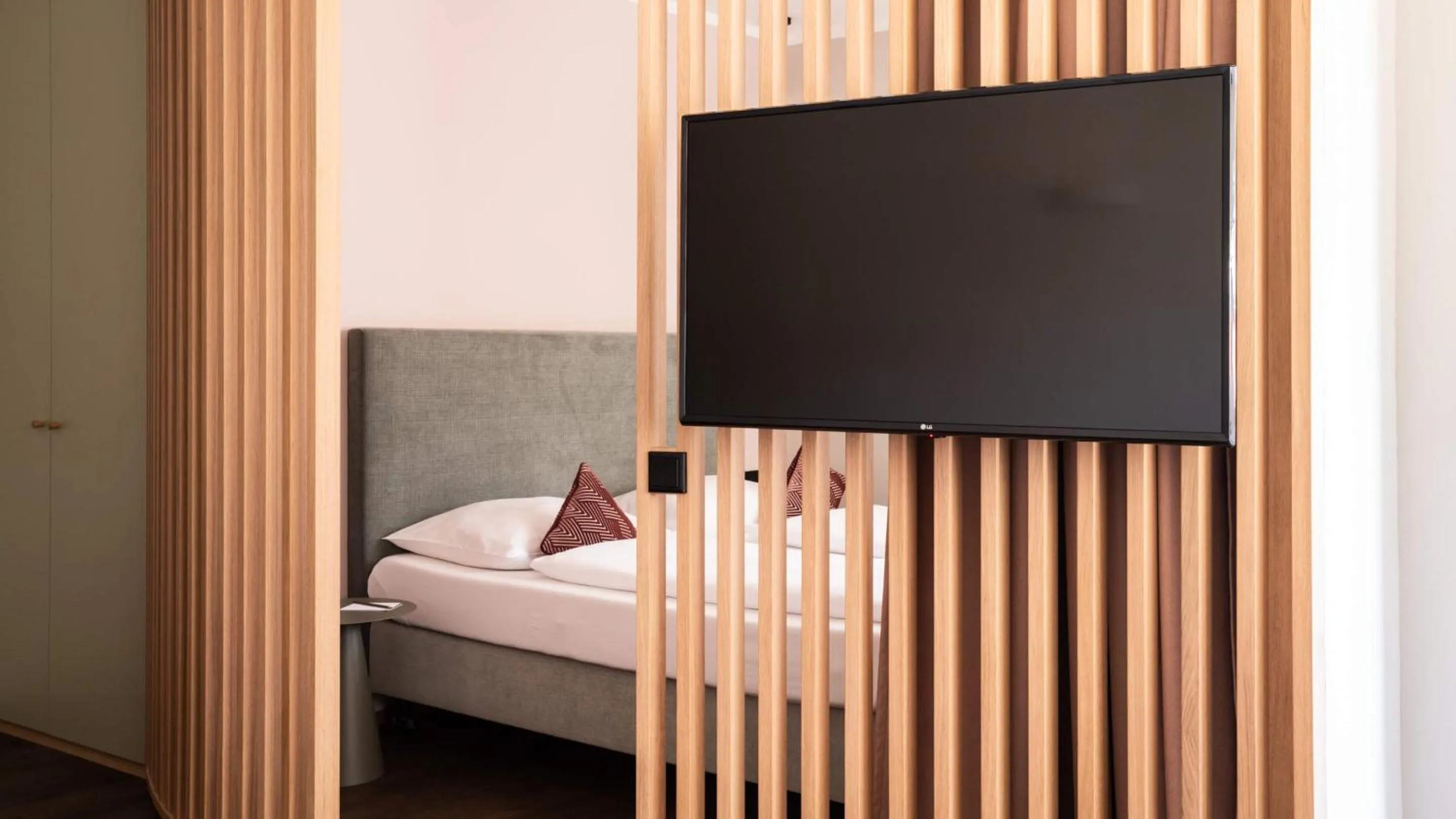 Bed in Flora Hotel & Suites