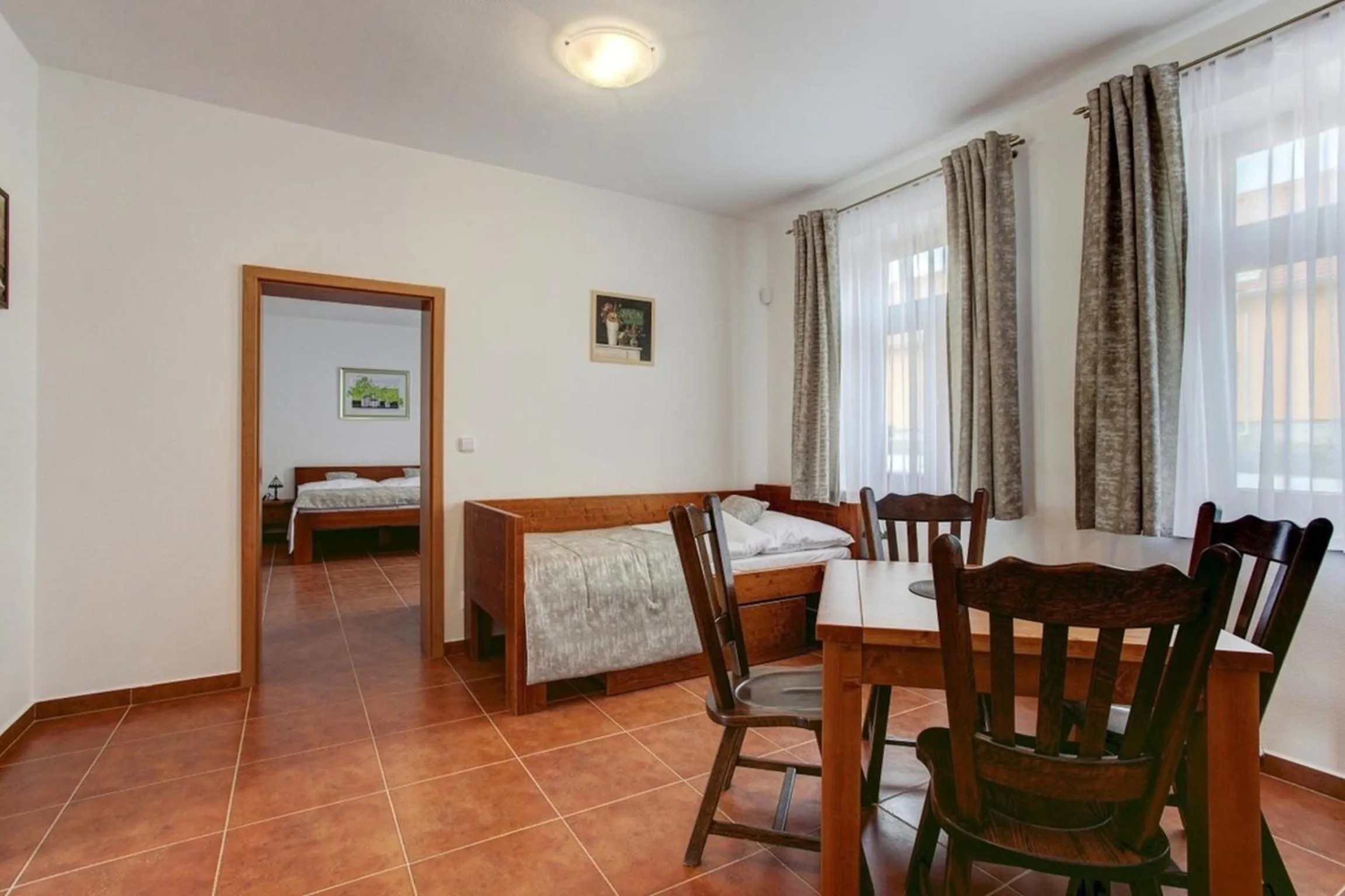 Kitchen or kitchenette, Bed in Apartmány U Anděla