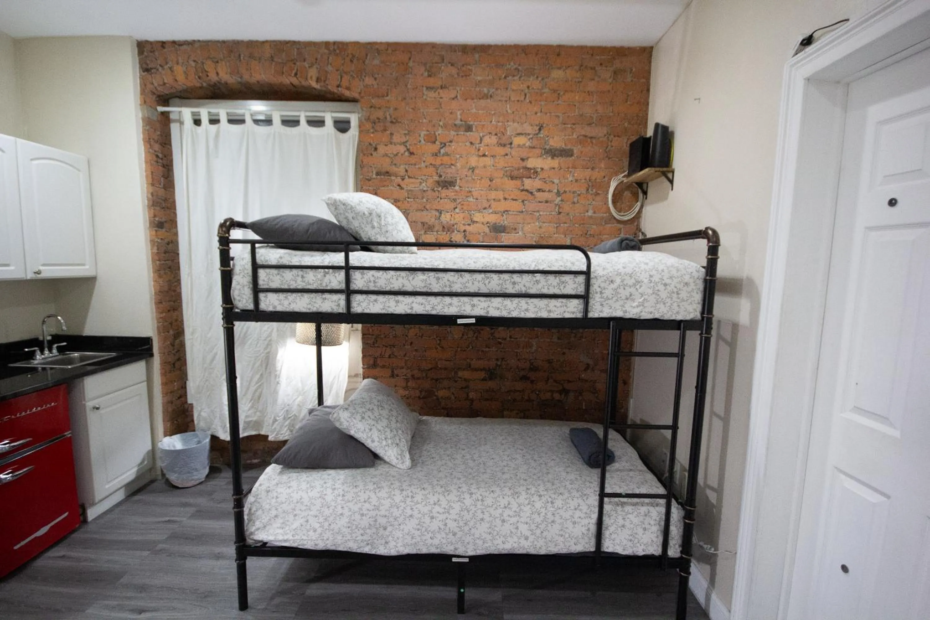 Bed in Studio Plus - Cozy Apartments