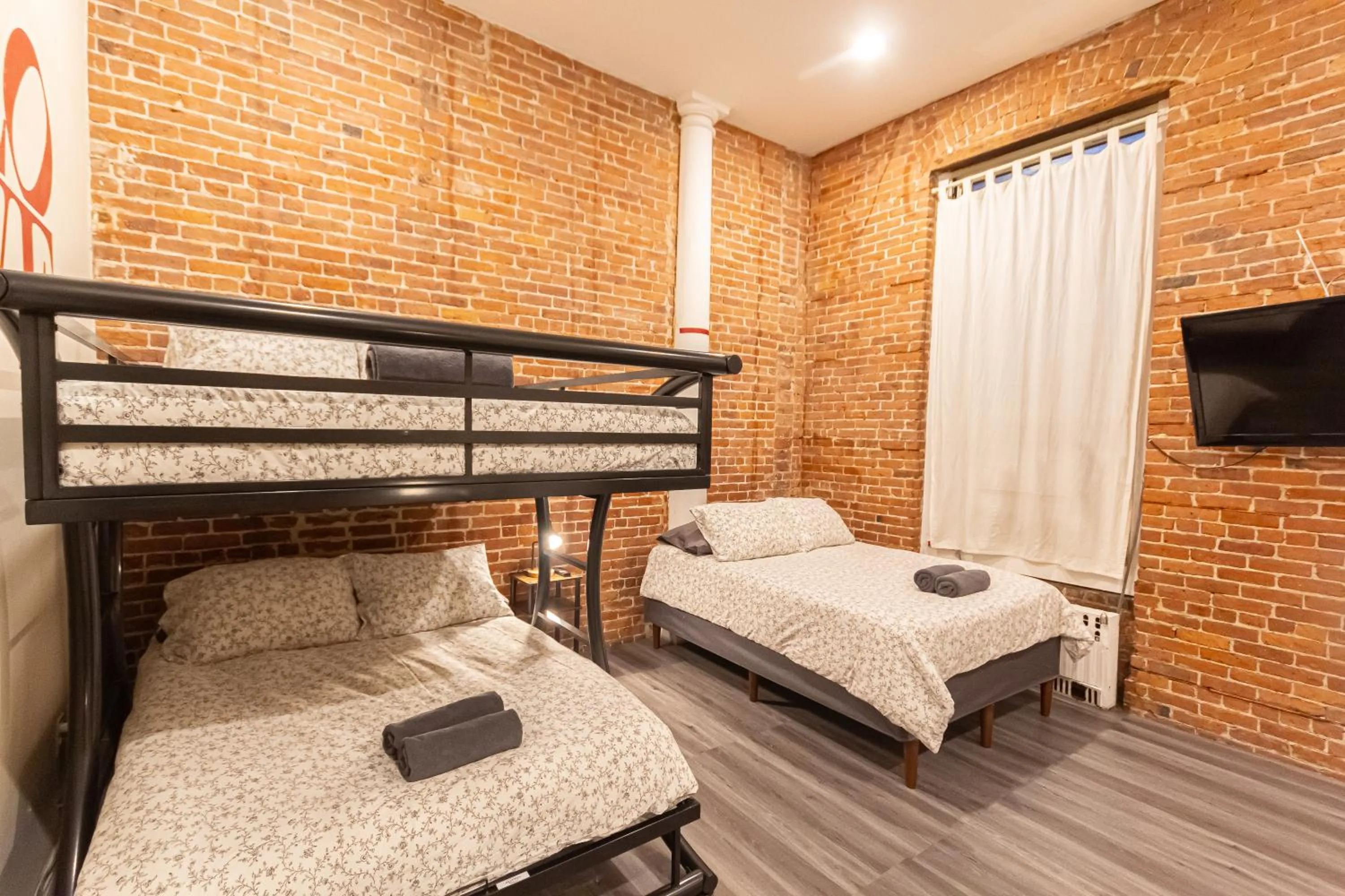 Bed in Studio Plus - Cozy Apartments