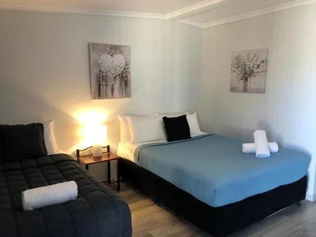 Bed in Jackie Howe Motel