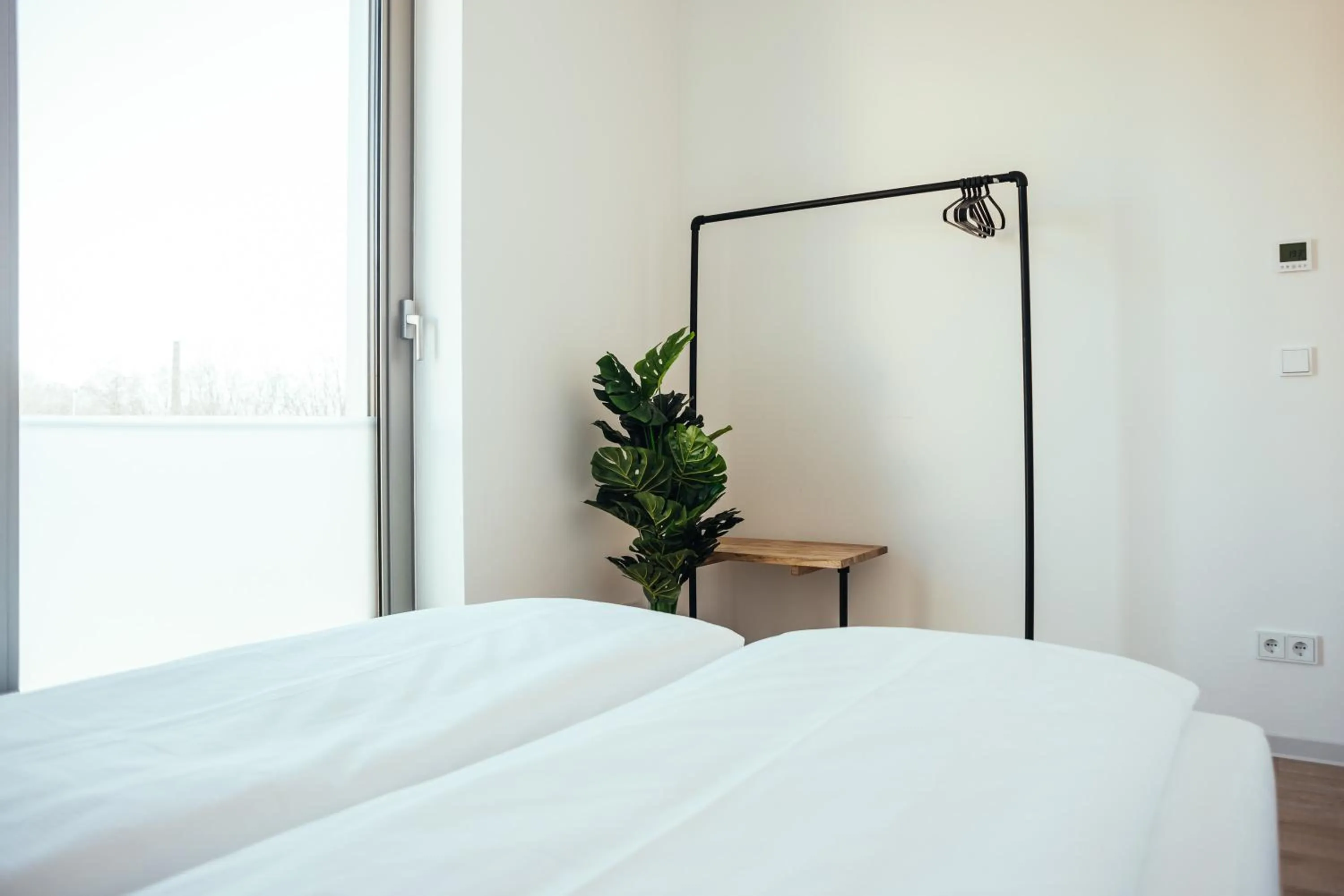 Bed in The Rix Studios & Suites