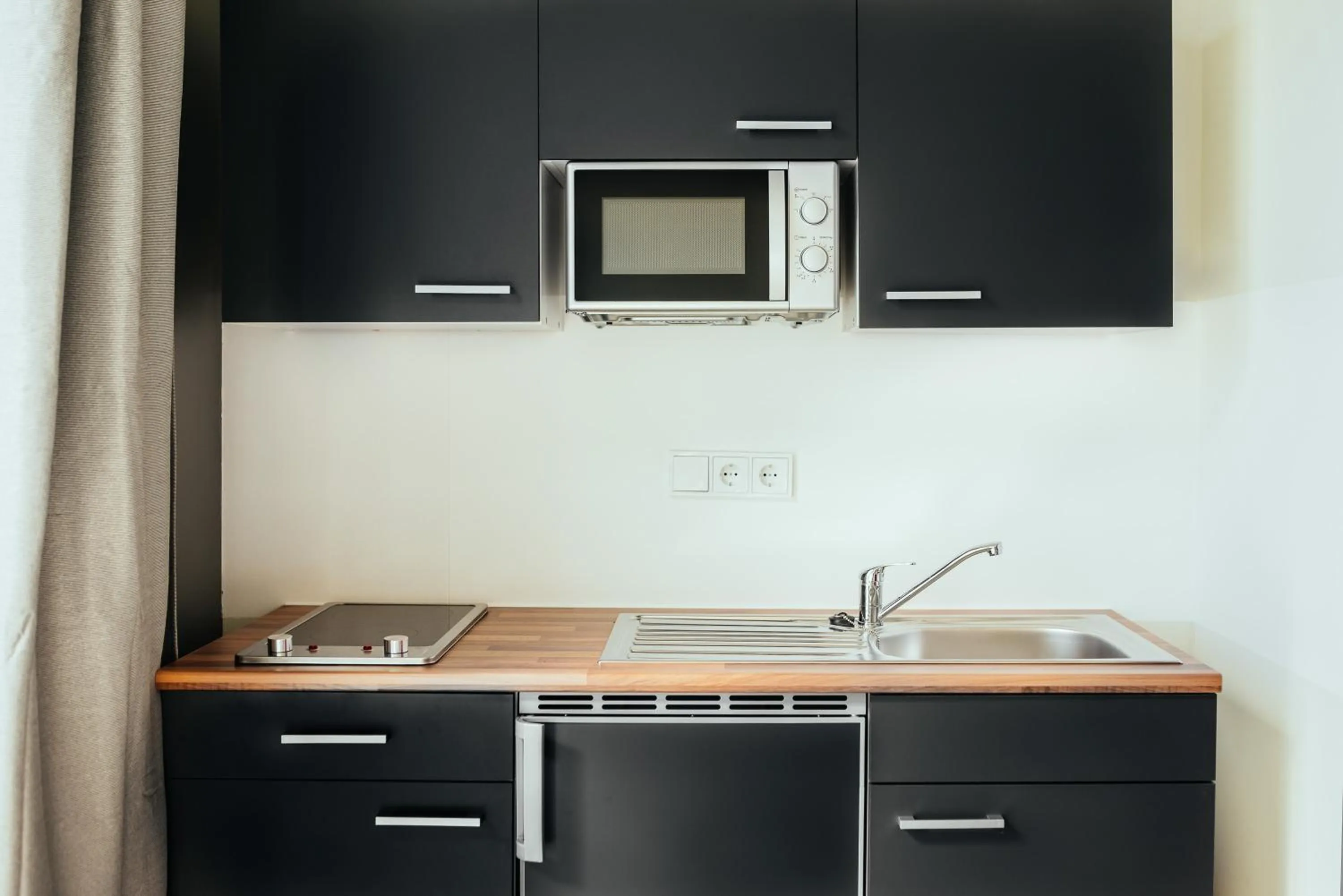 Kitchen or kitchenette in The Rix Studios & Suites