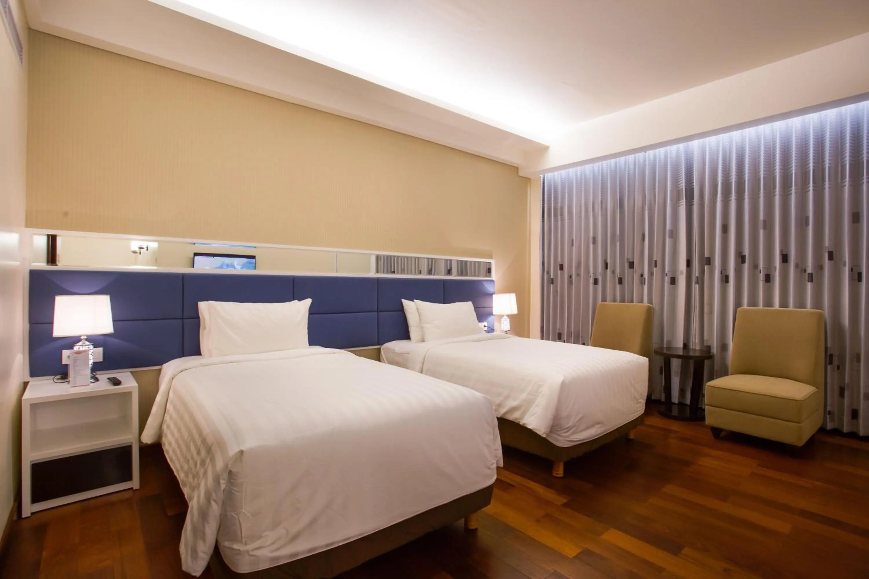 Bed in Golden Palace Hotel Lombok