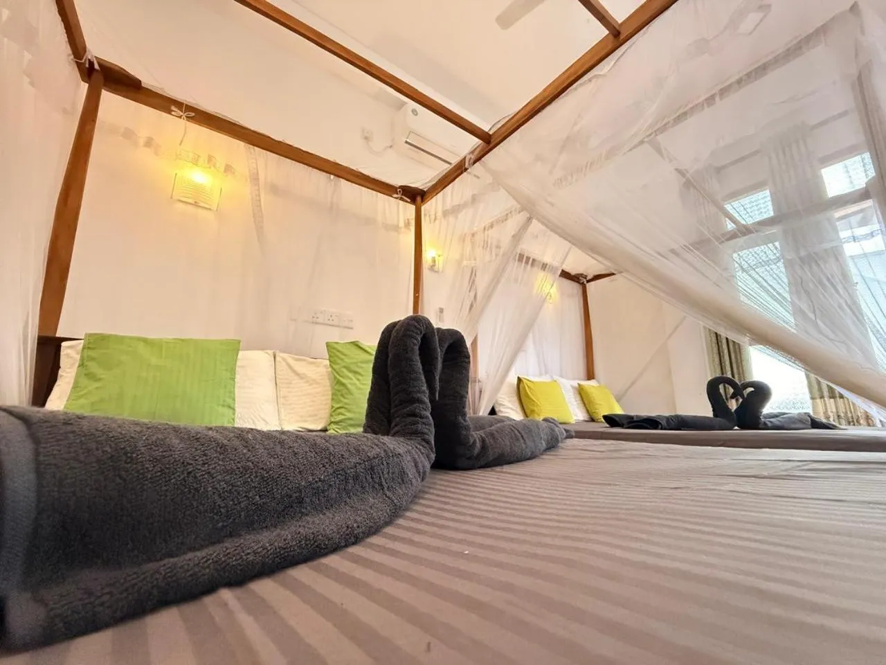 Bed in Pearl Deluna Resort Mirissa