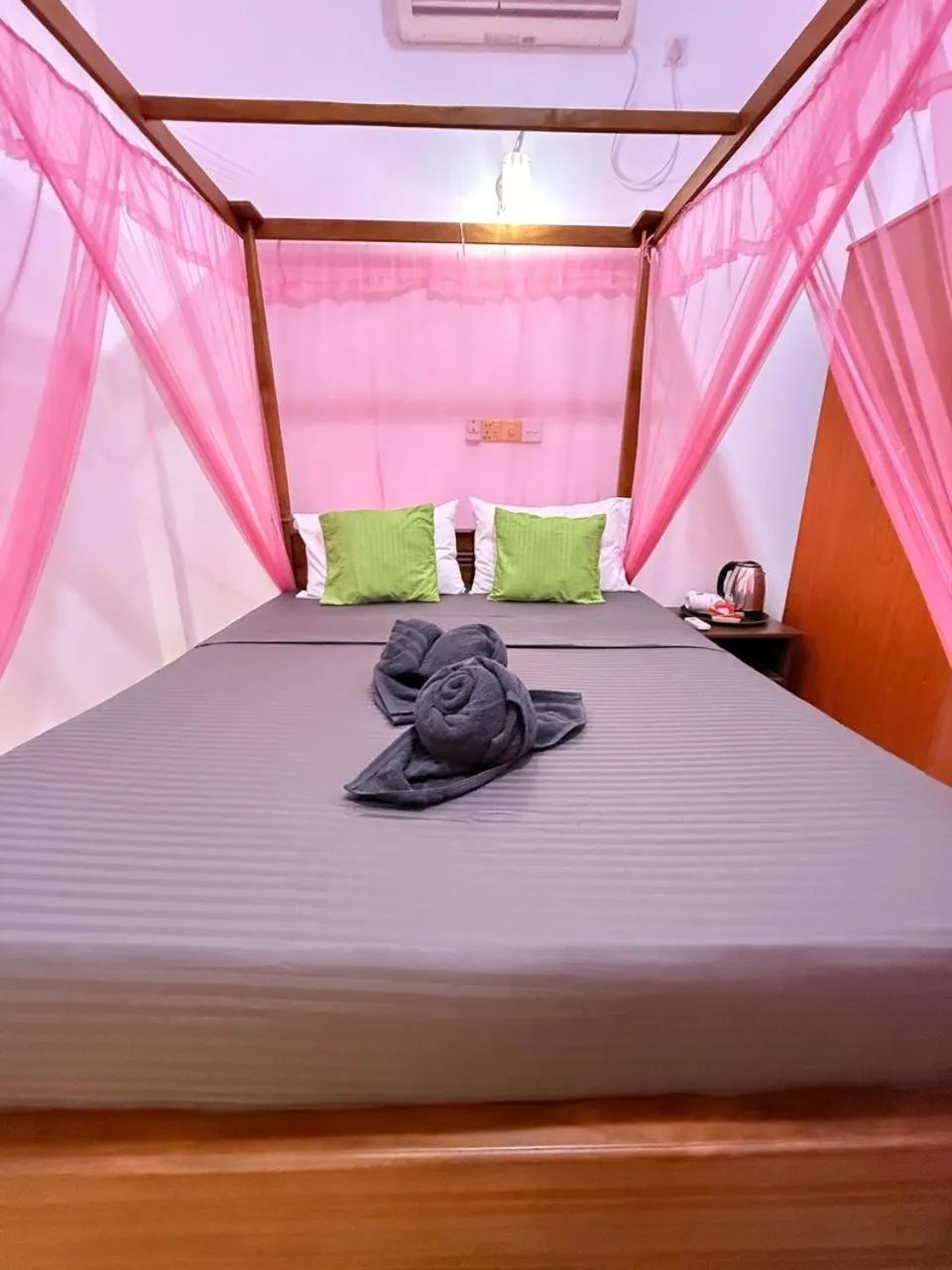 Bed in Pearl Deluna Resort Mirissa