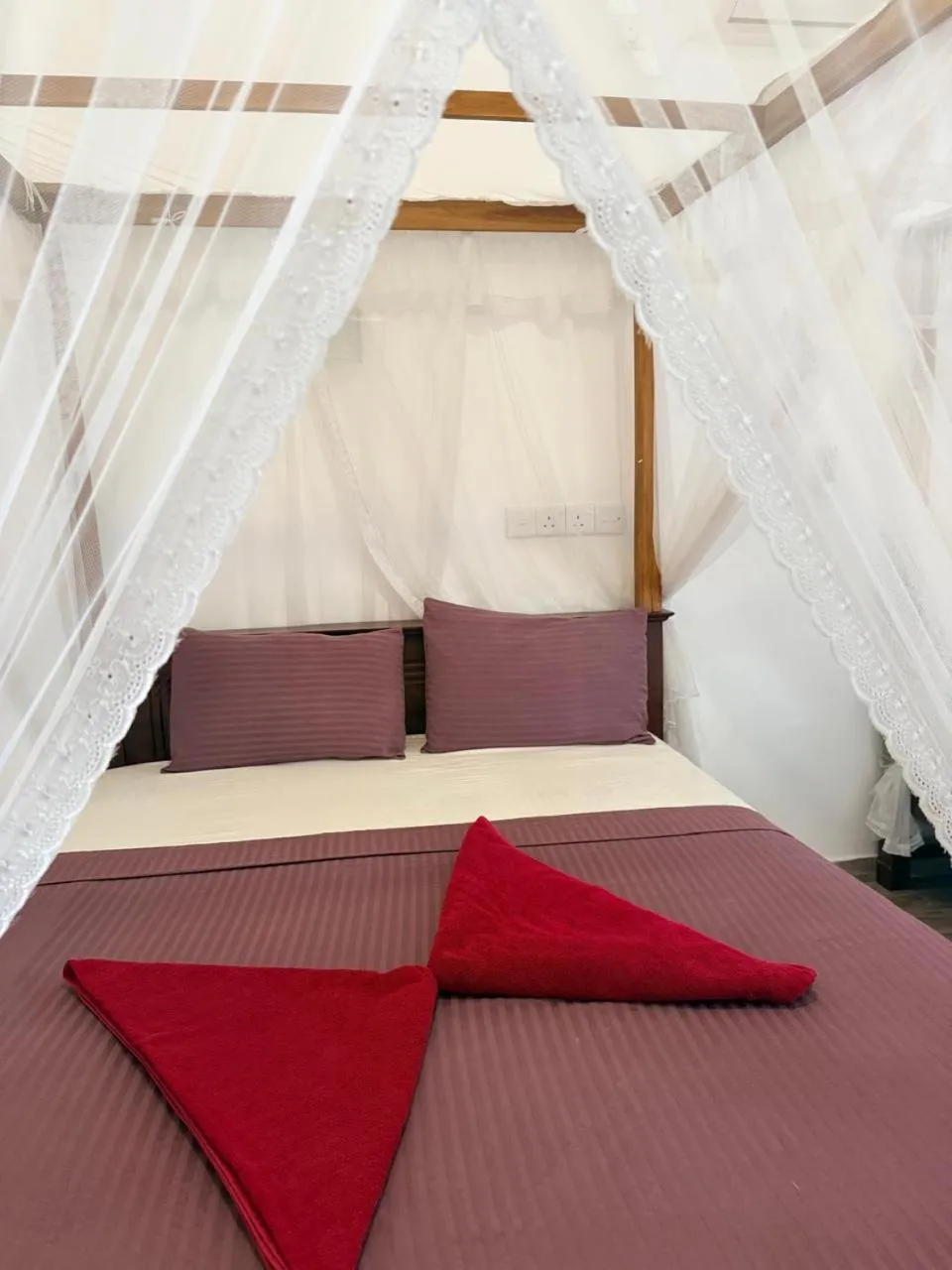 Bed in Pearl Deluna Resort Mirissa