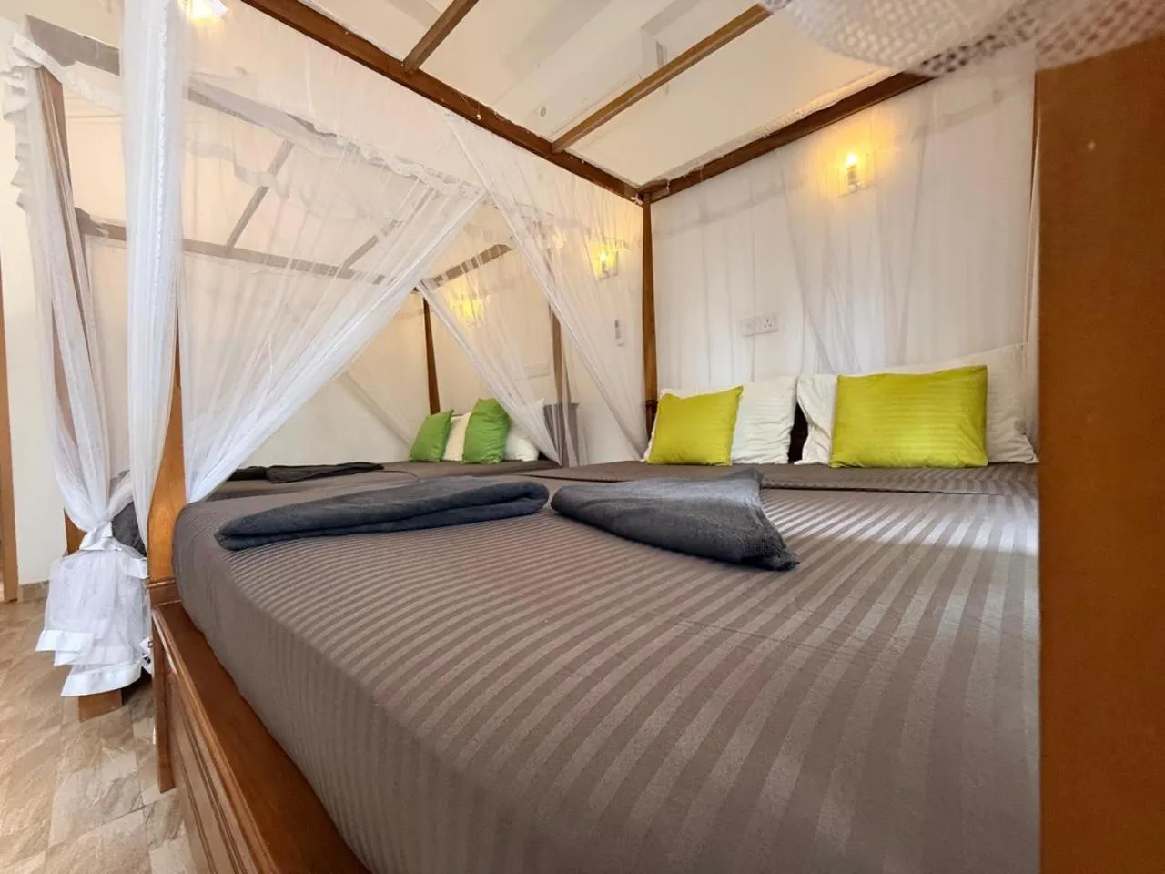 Bed in Pearl Deluna Resort Mirissa