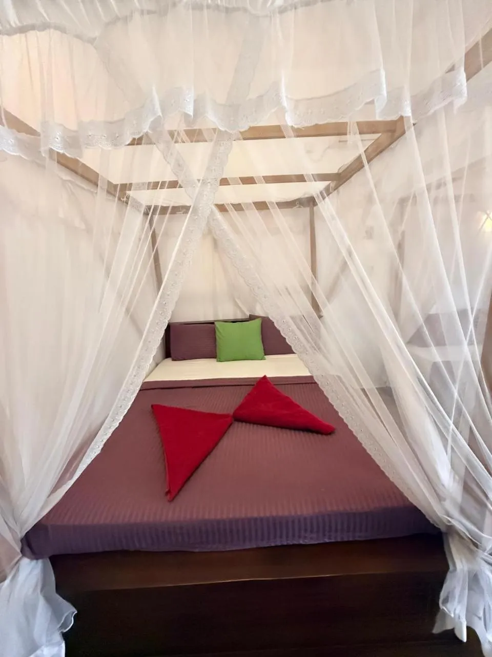 Bed in Pearl Deluna Resort Mirissa