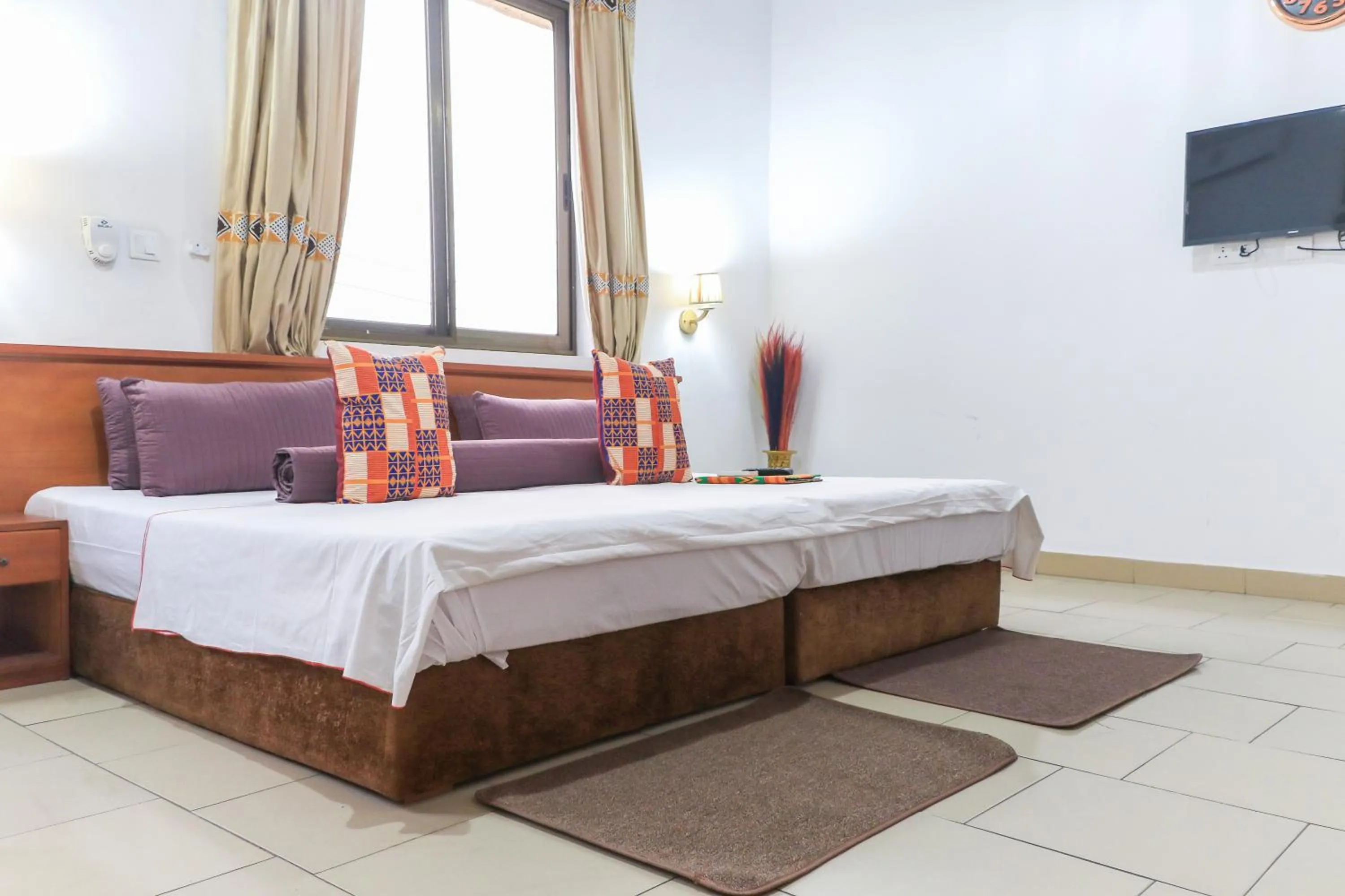 Bed in Asantewaa Premier Hotel