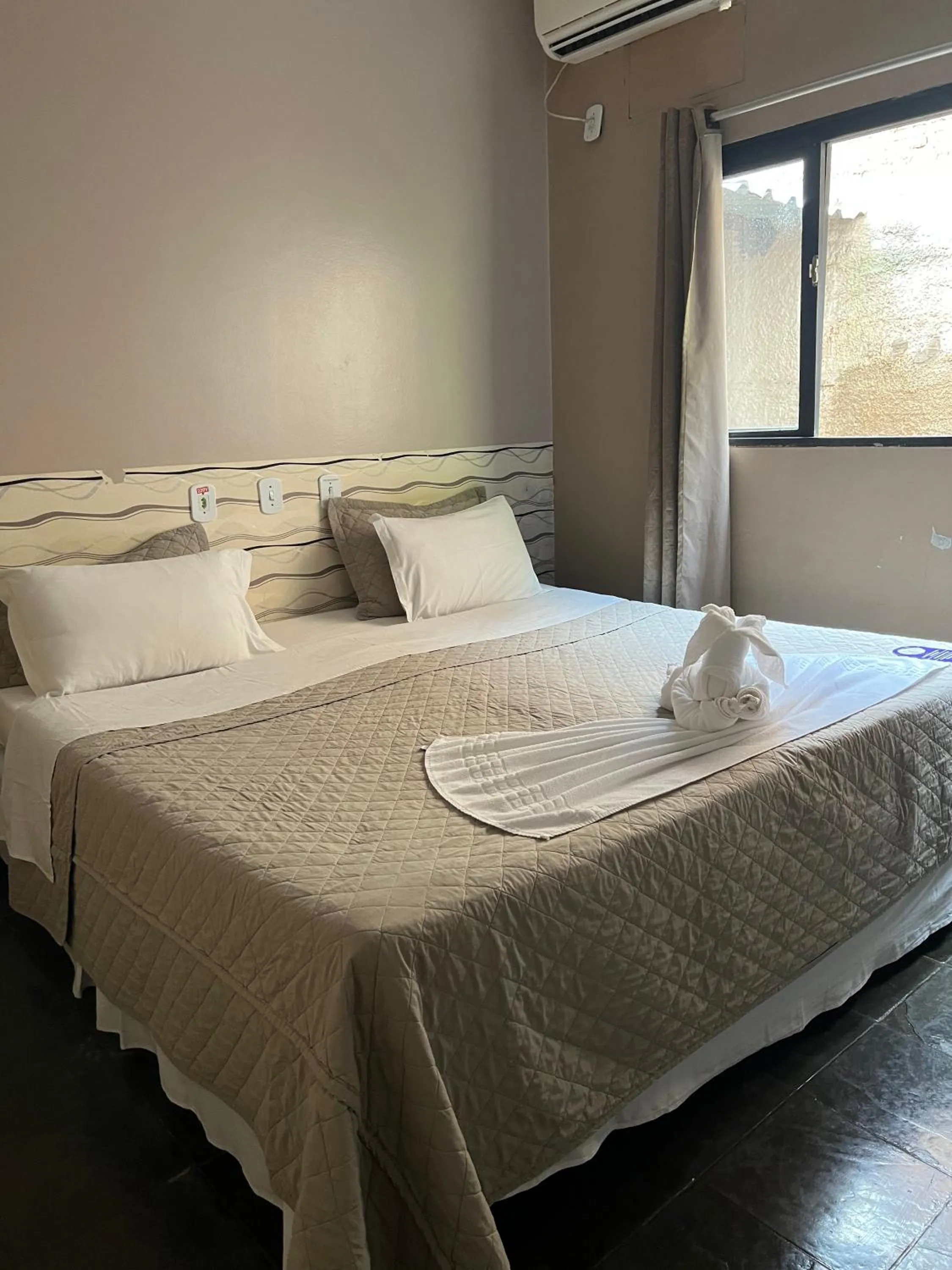 Bed in Pousada Sol do Araguaia