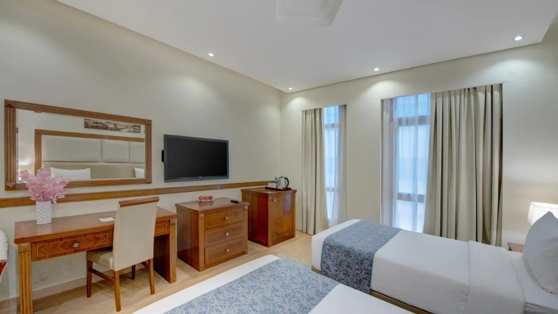 Bed in Vendome Plaza Hotel