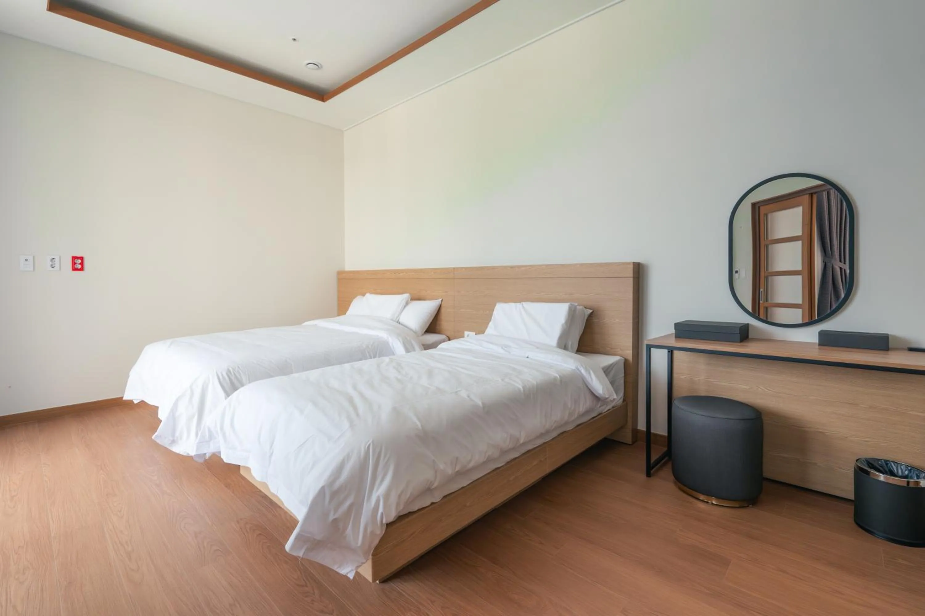 Bed in Dongho Beach Hotel