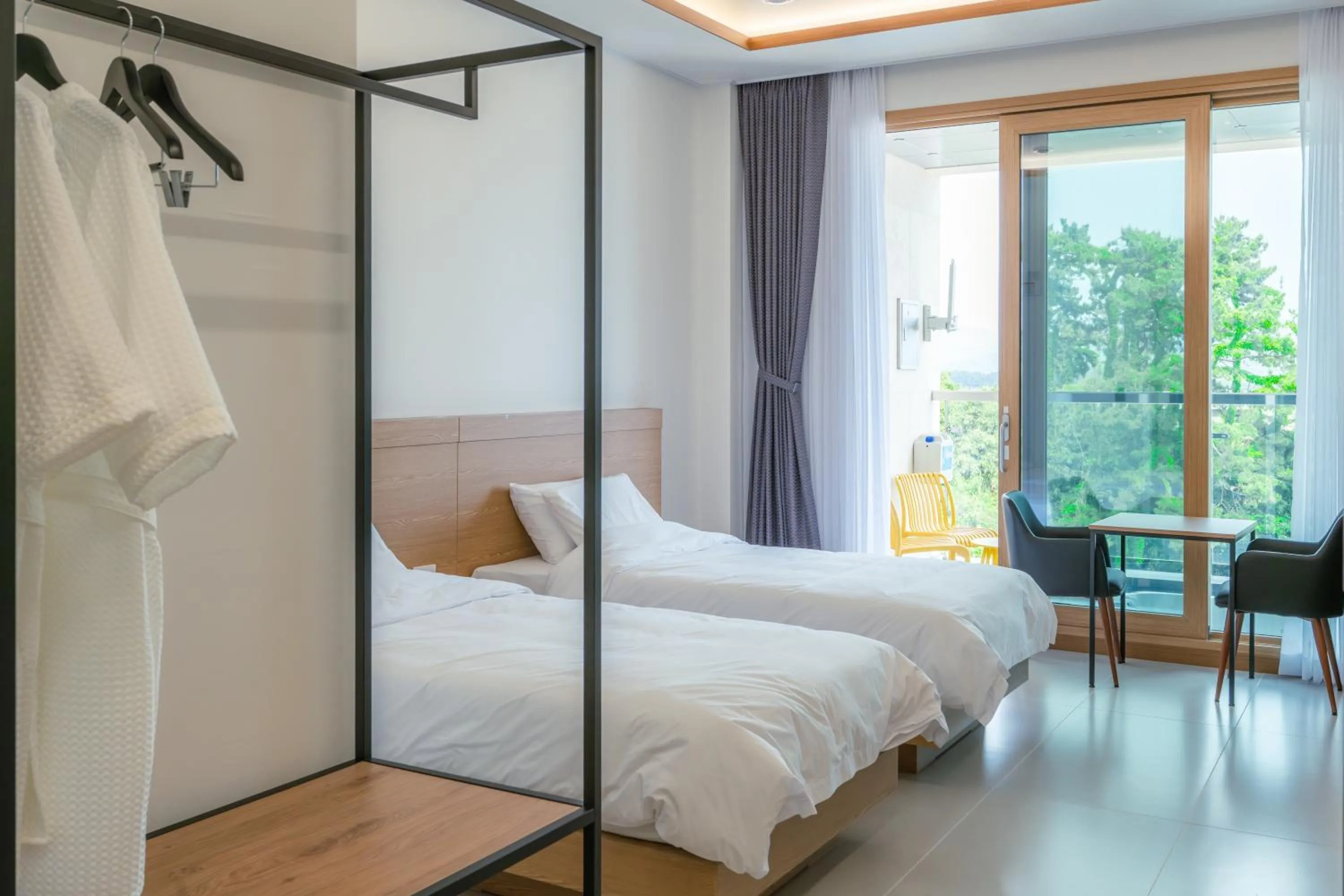 Bed in Dongho Beach Hotel