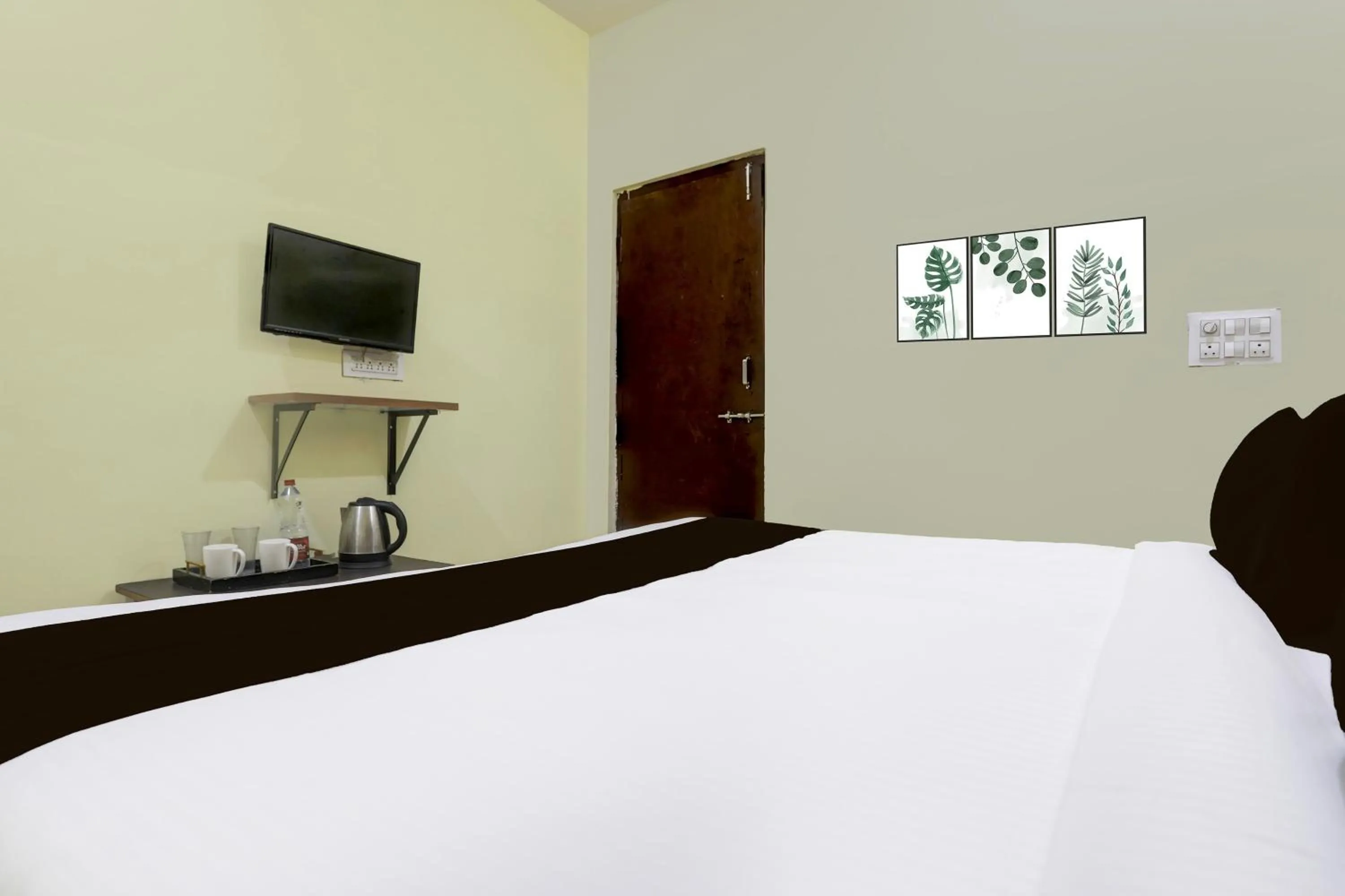 Bedroom, Bed in SPOT ON SRI KARTHIK GRAND INN