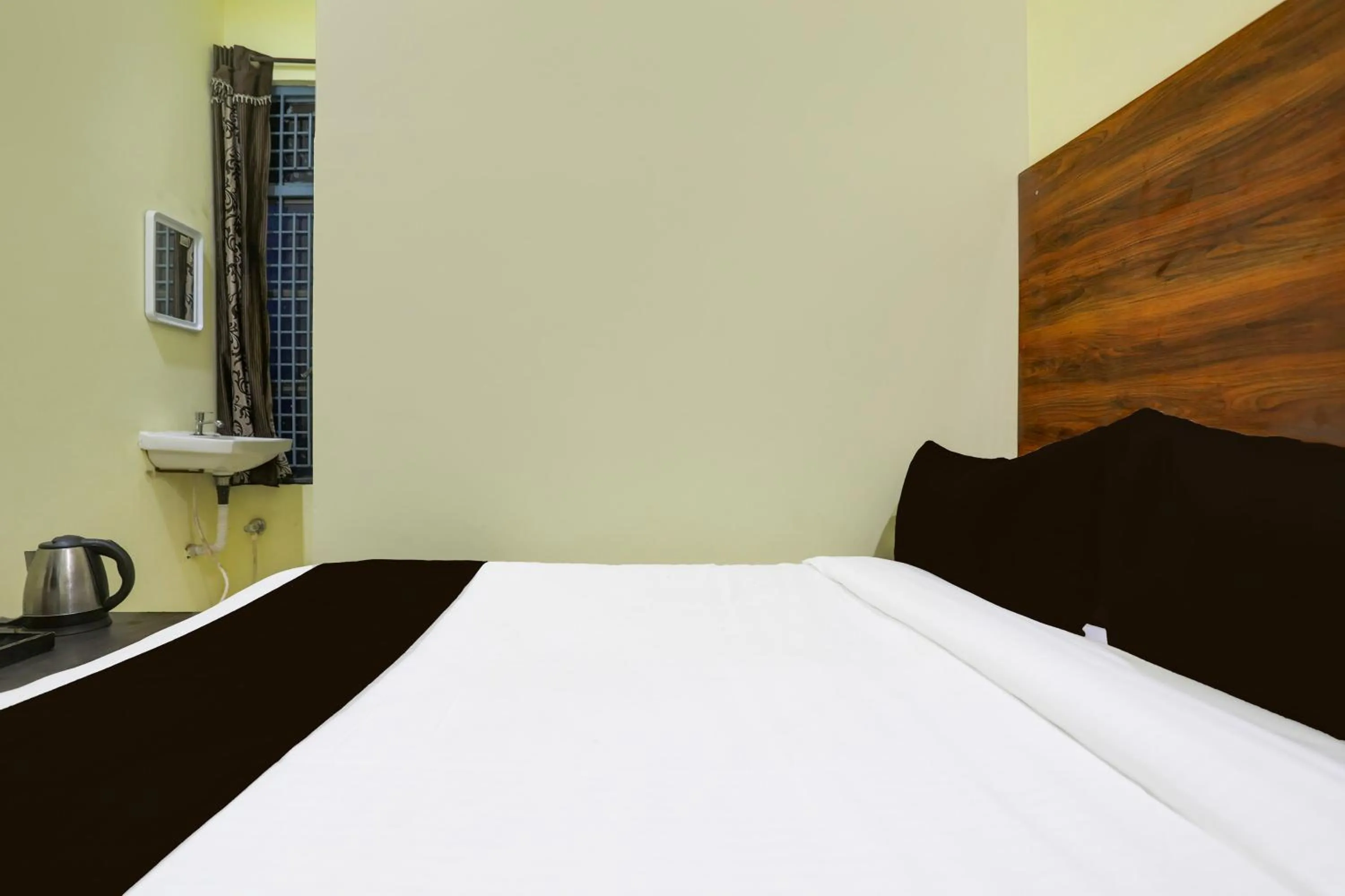 Bedroom, Bed in SPOT ON SRI KARTHIK GRAND INN