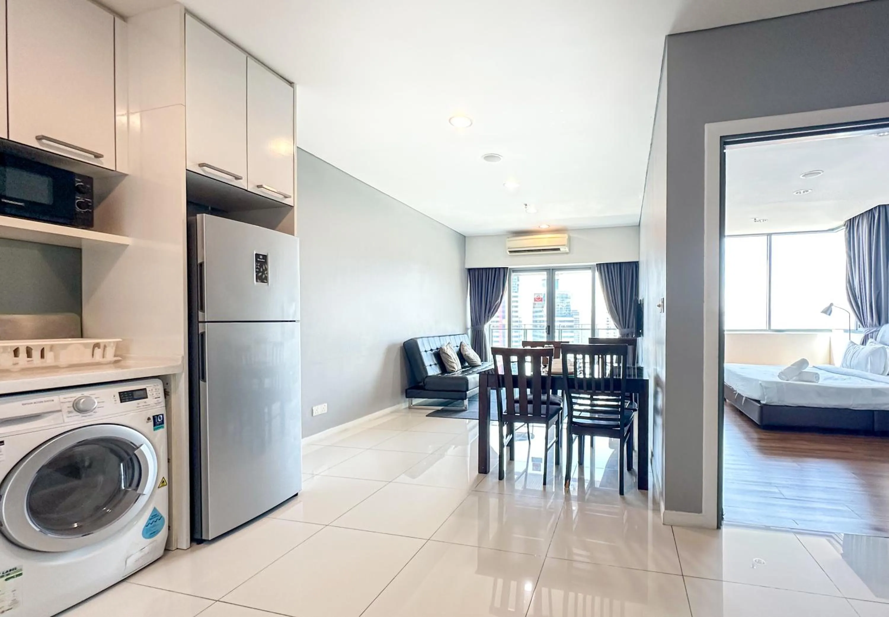 Living room, Bed in Summer Suites KLCC by apartx