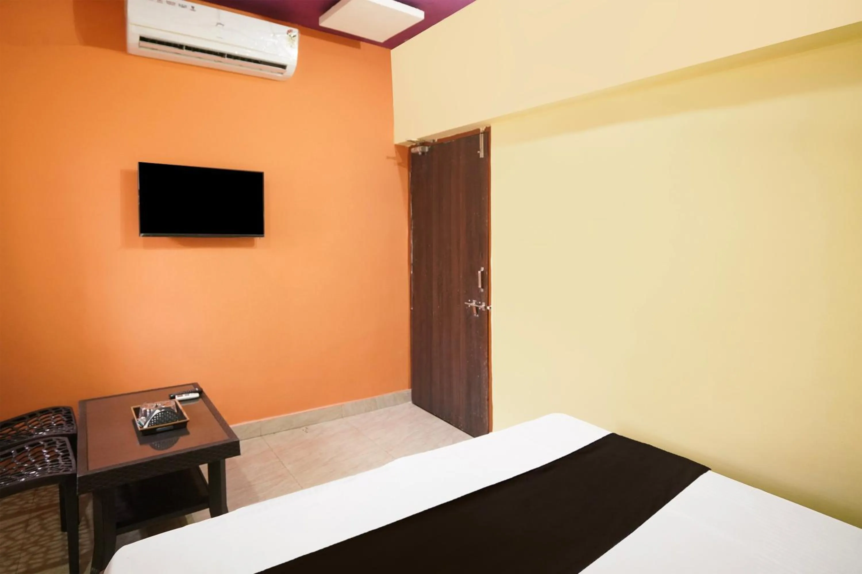 Bedroom in Hotel O Happy Hotel