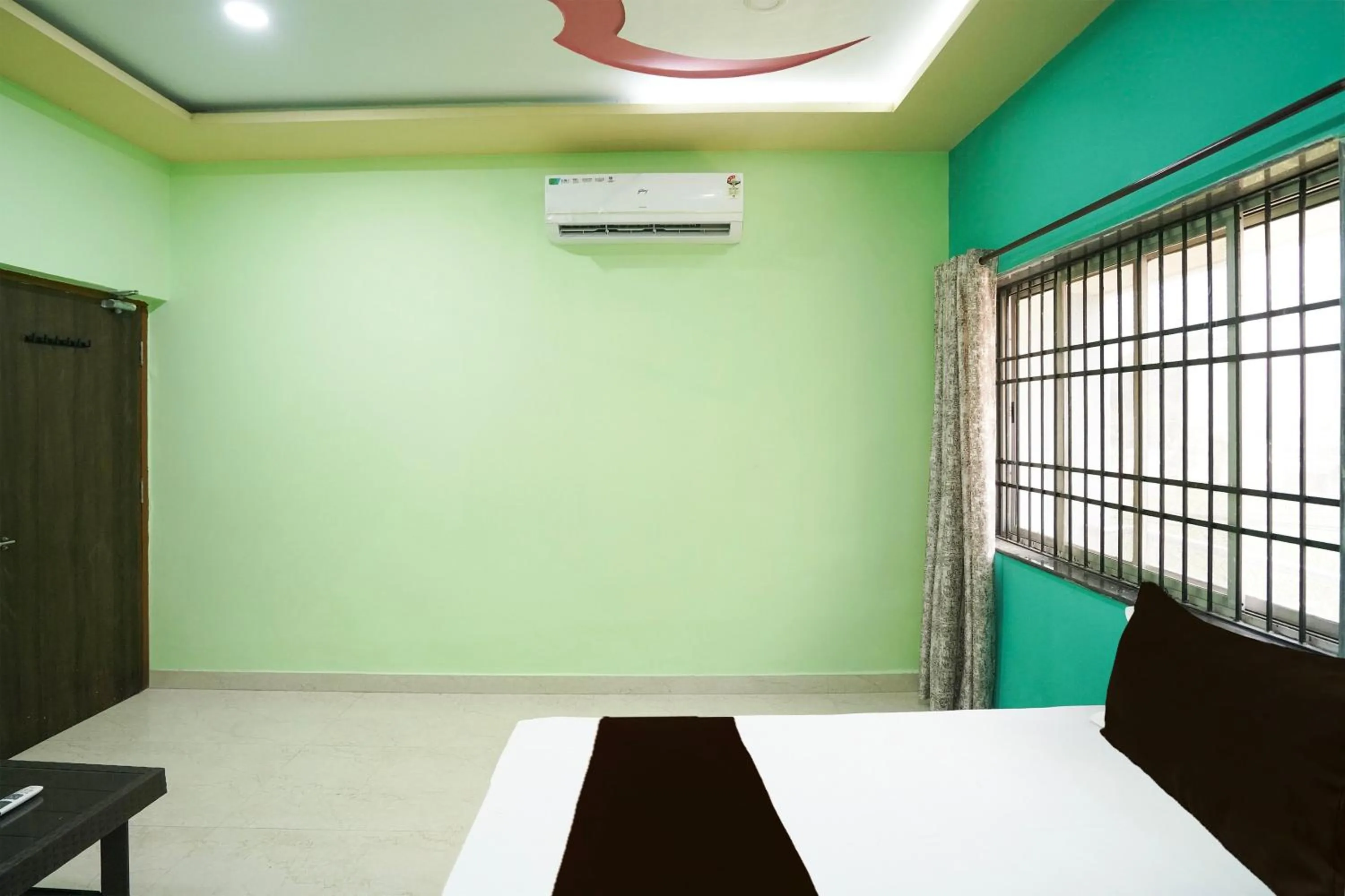 Bedroom in Hotel O Happy Hotel