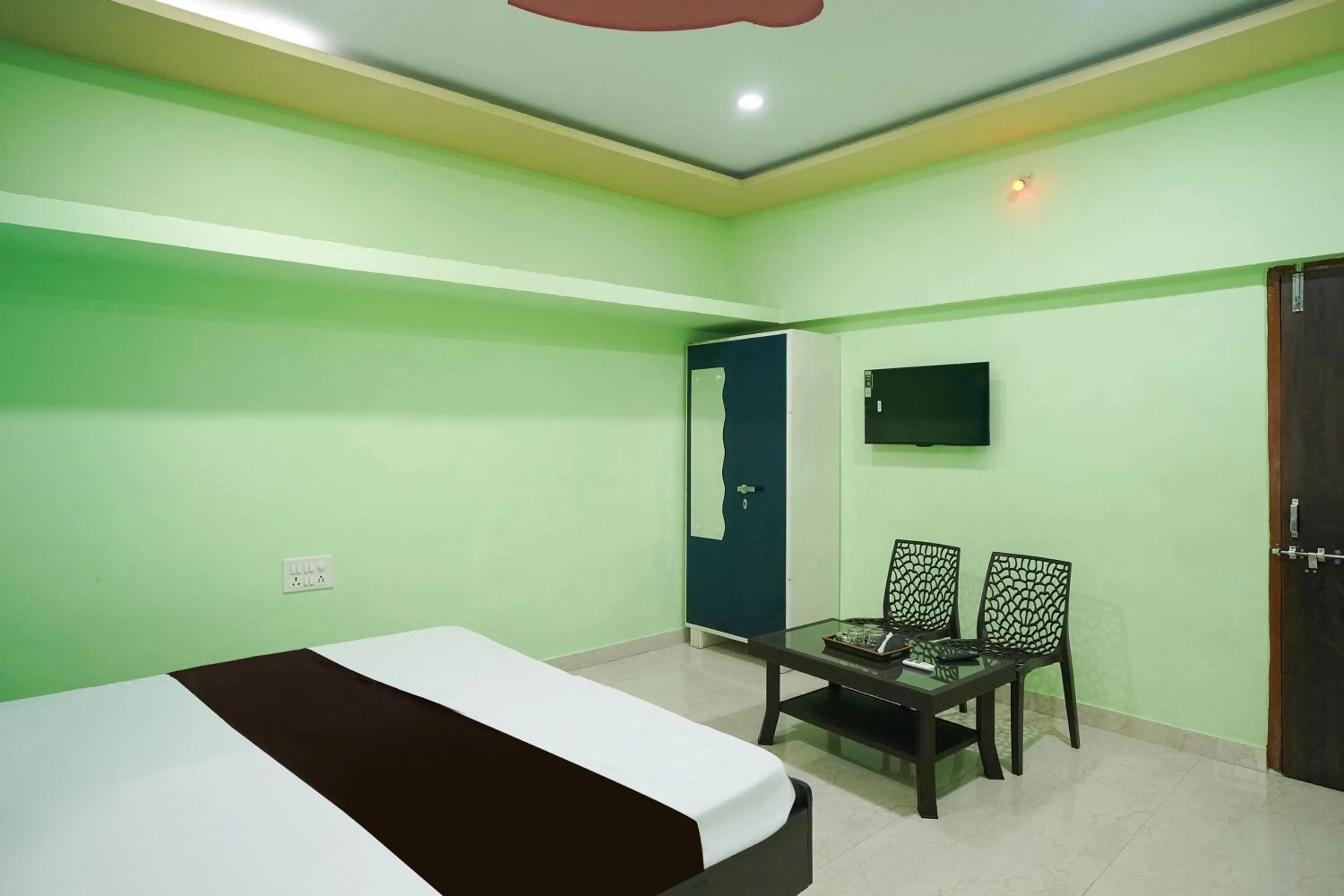 Bedroom in Hotel O Happy Hotel