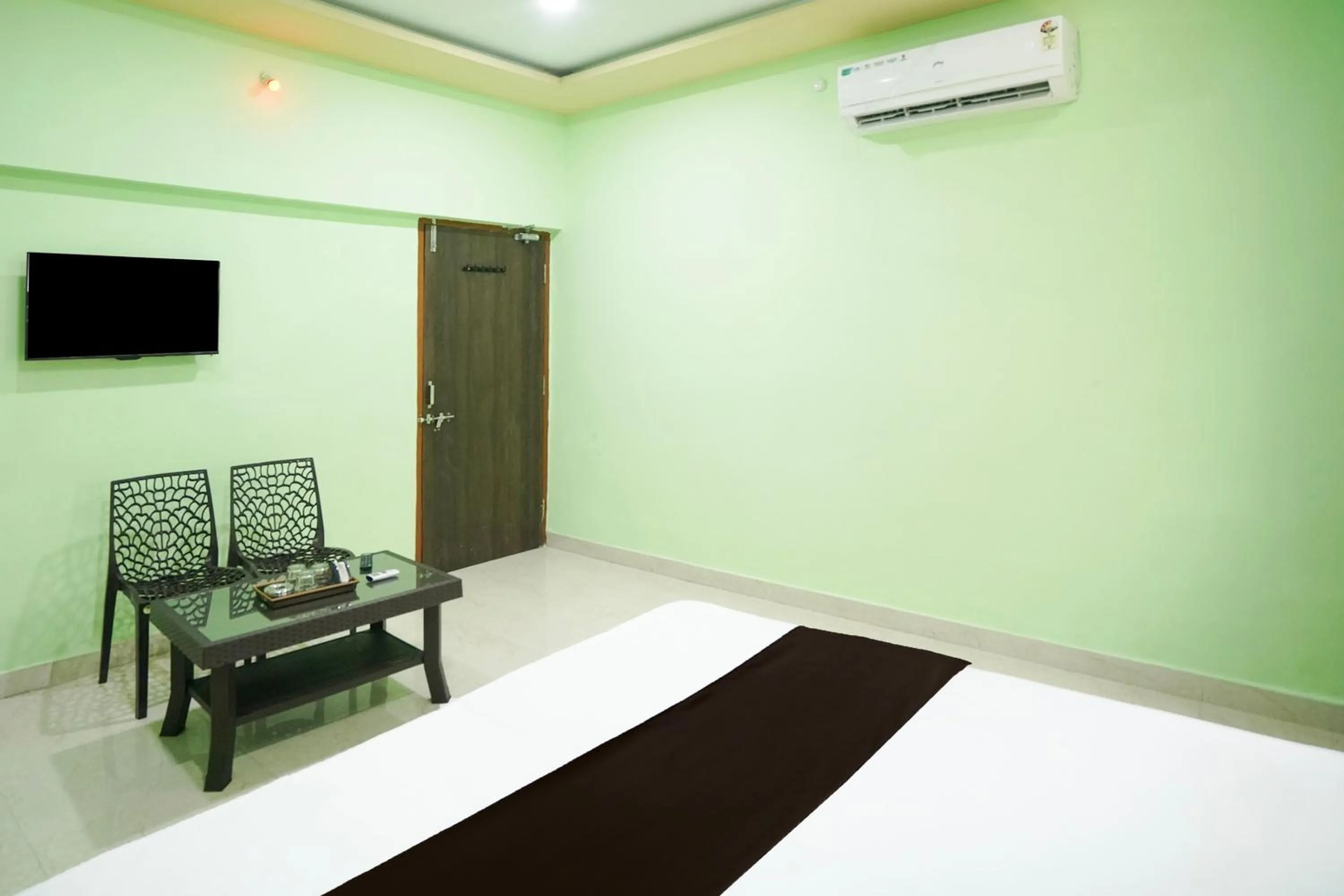 Bedroom in Hotel O Happy Hotel