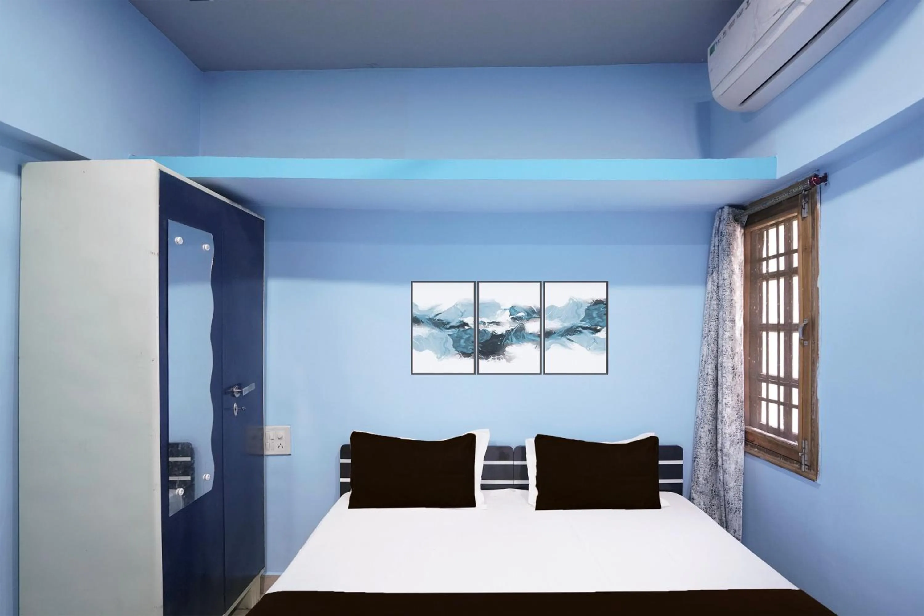 Bedroom in Hotel O Happy Hotel