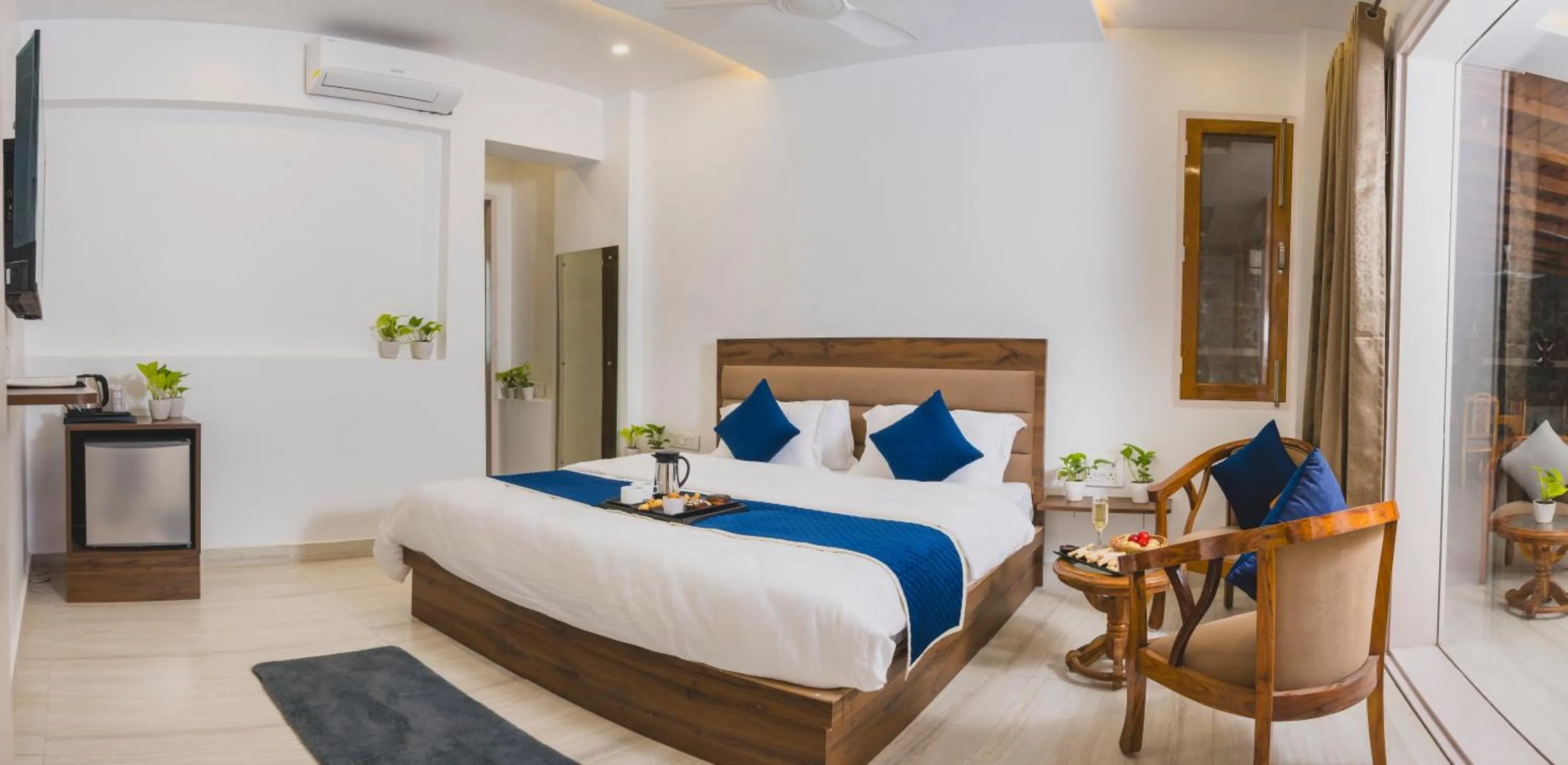 Photo of the whole room, Bed in Navya Stays