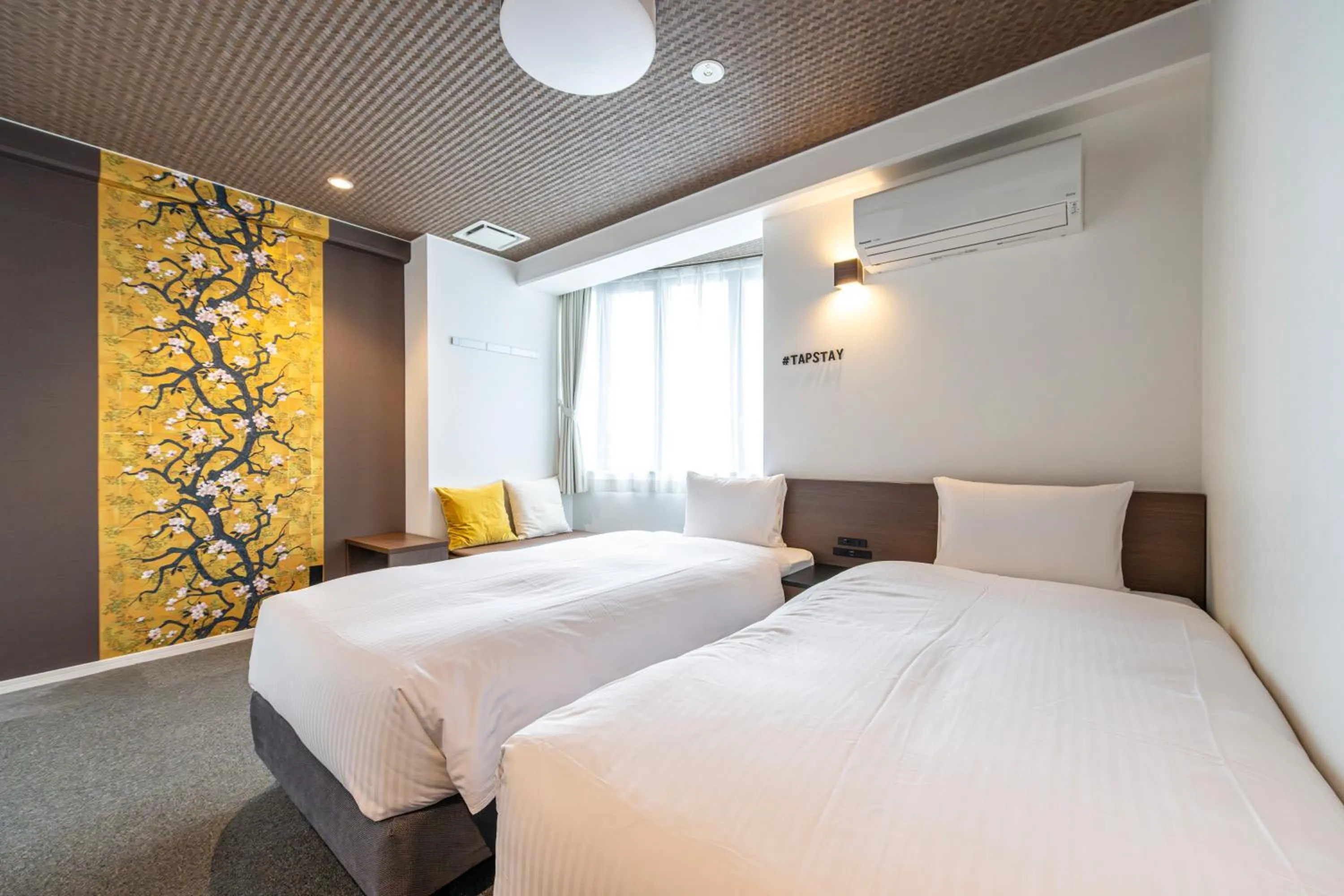 Bed in TapStay Hotel