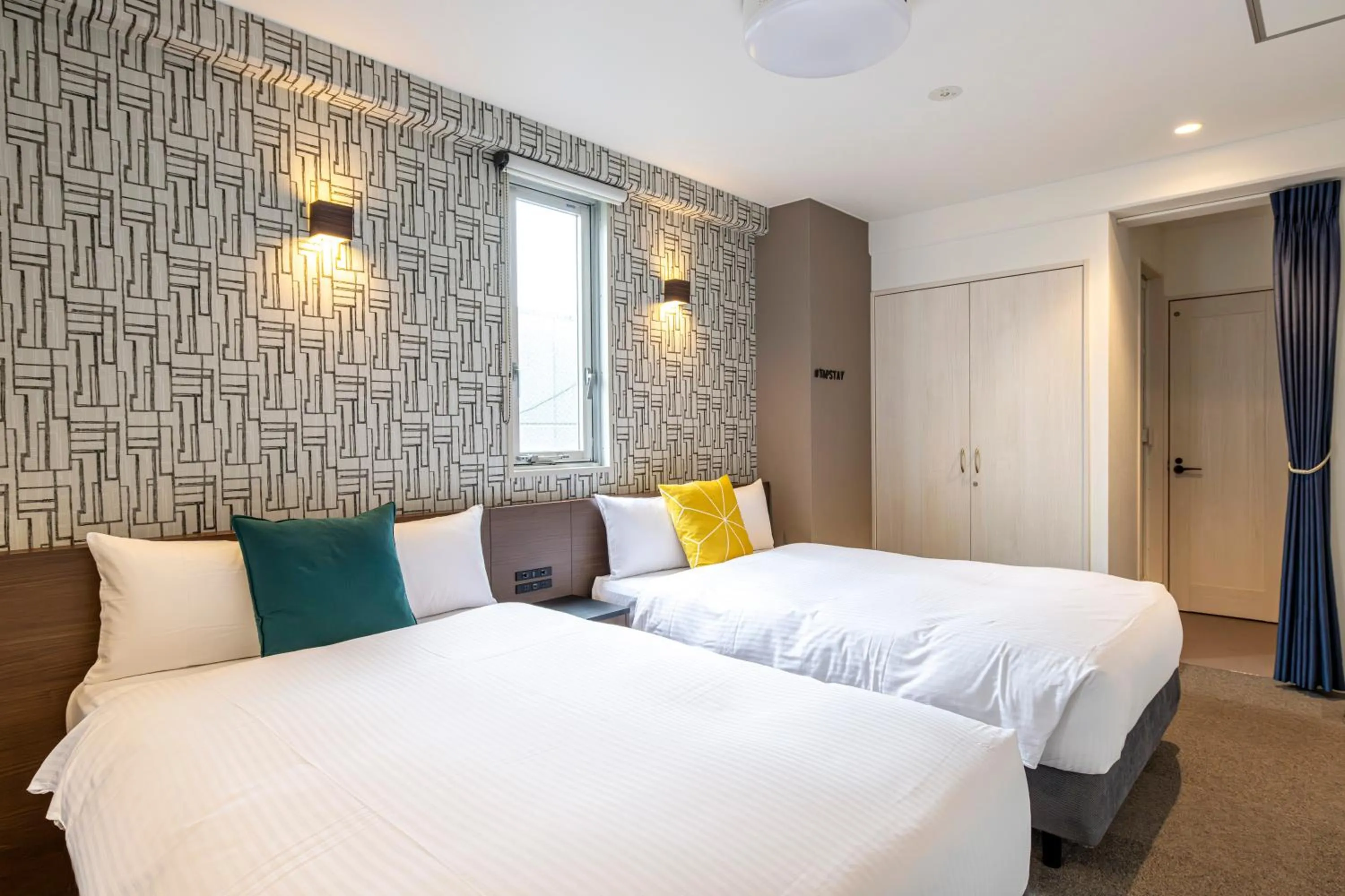 Bed in TapStay Hotel