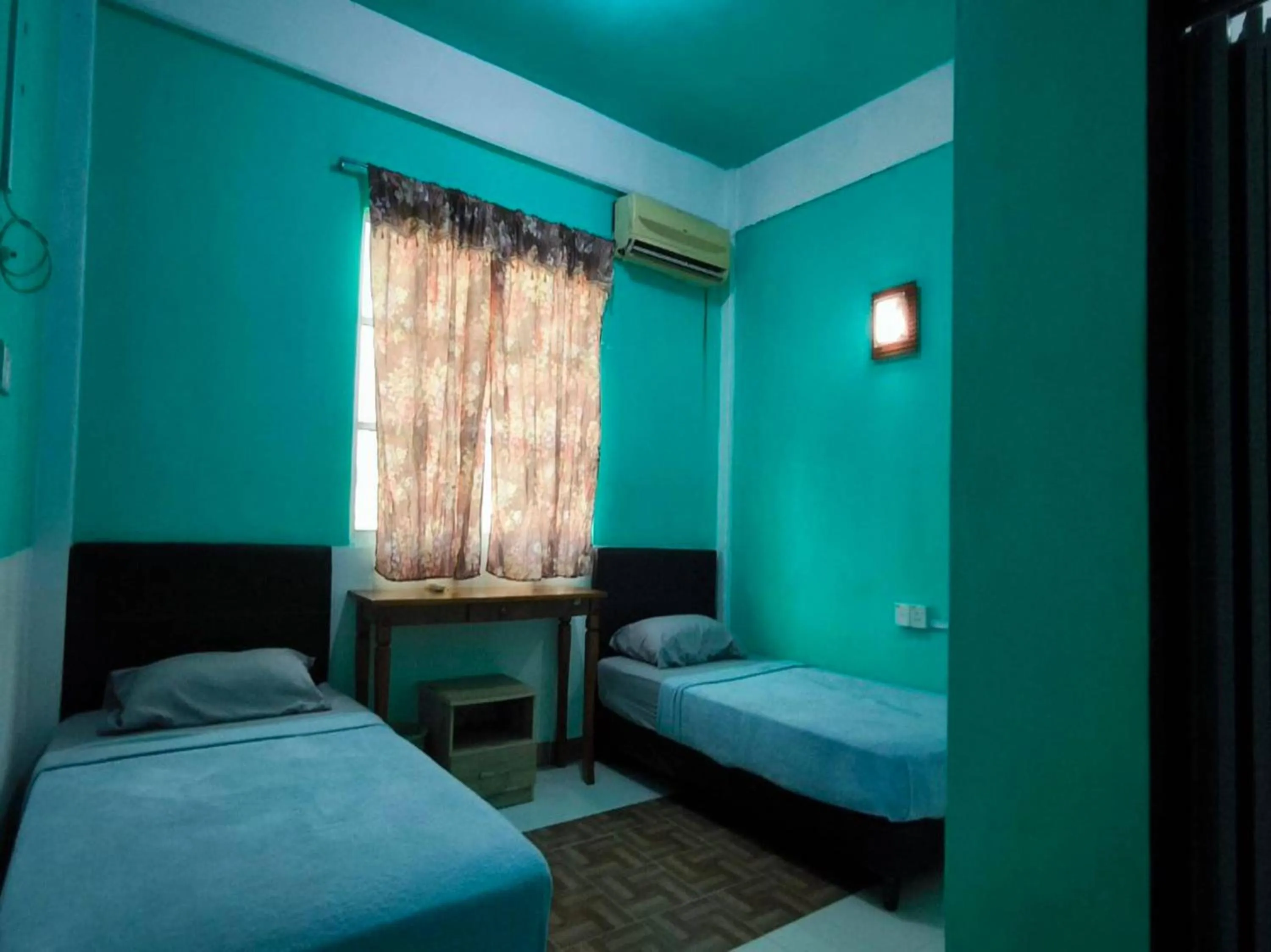 Bedroom in OYO 91012 Cenang Motel