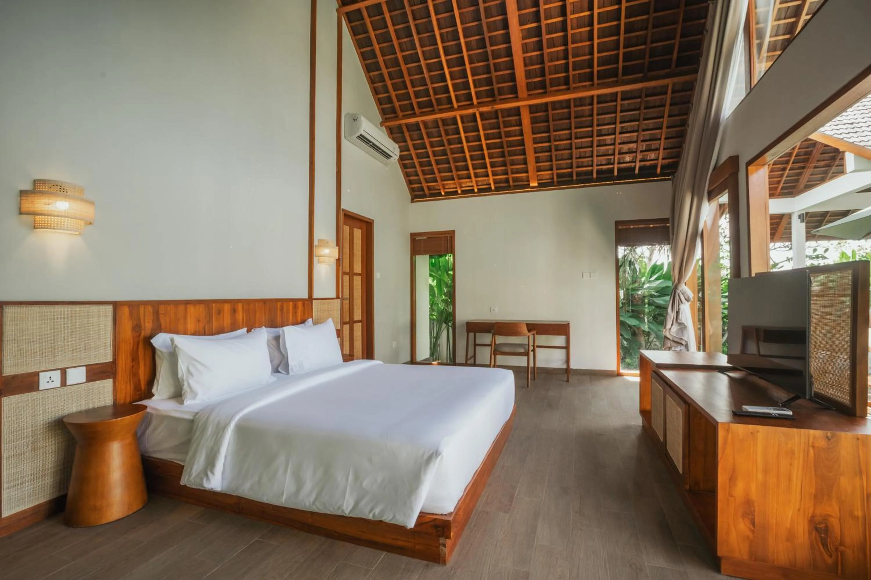 Bed in Arpana Luxury Private Pool Villas