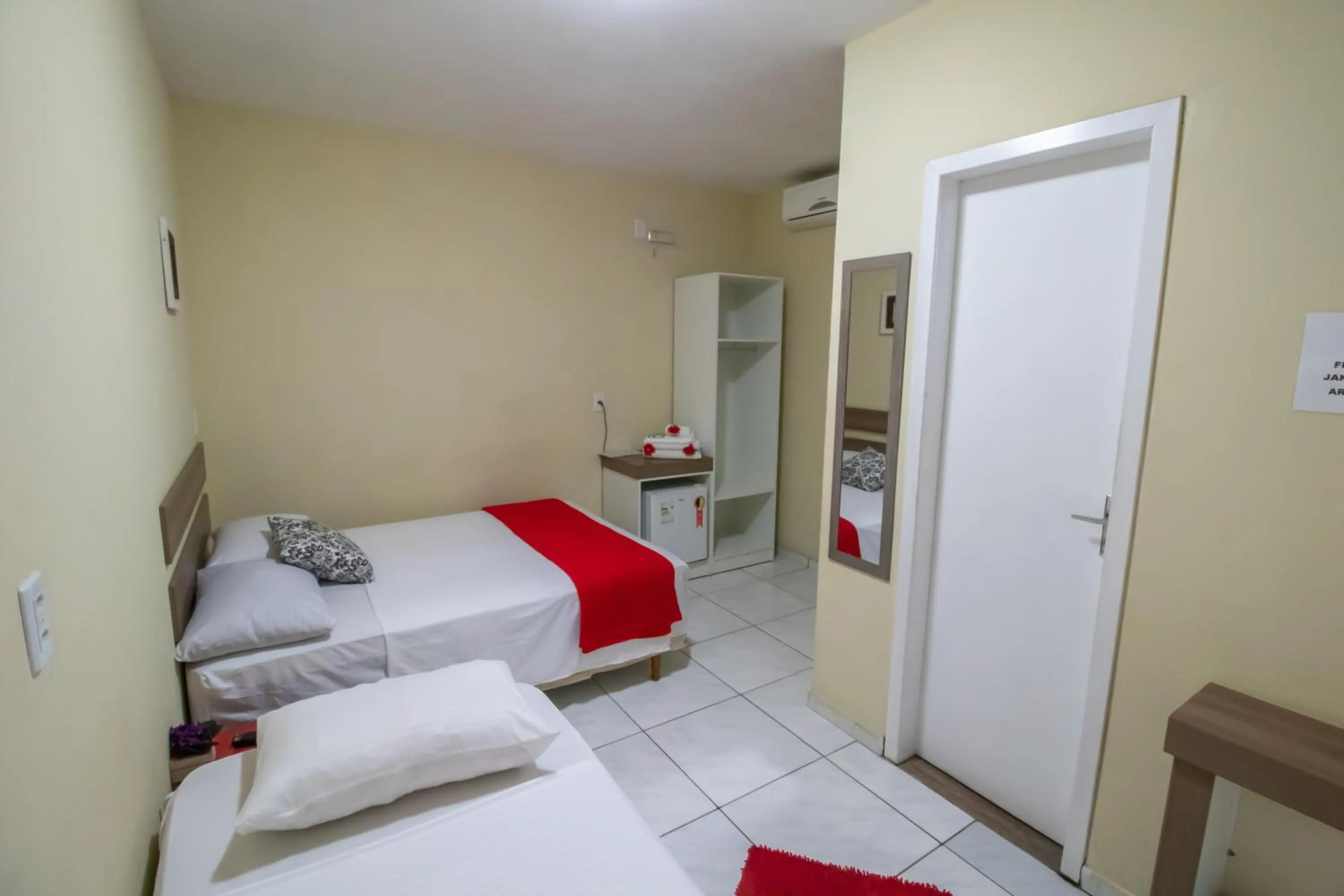 Bed in Pousada Vovó Dilma