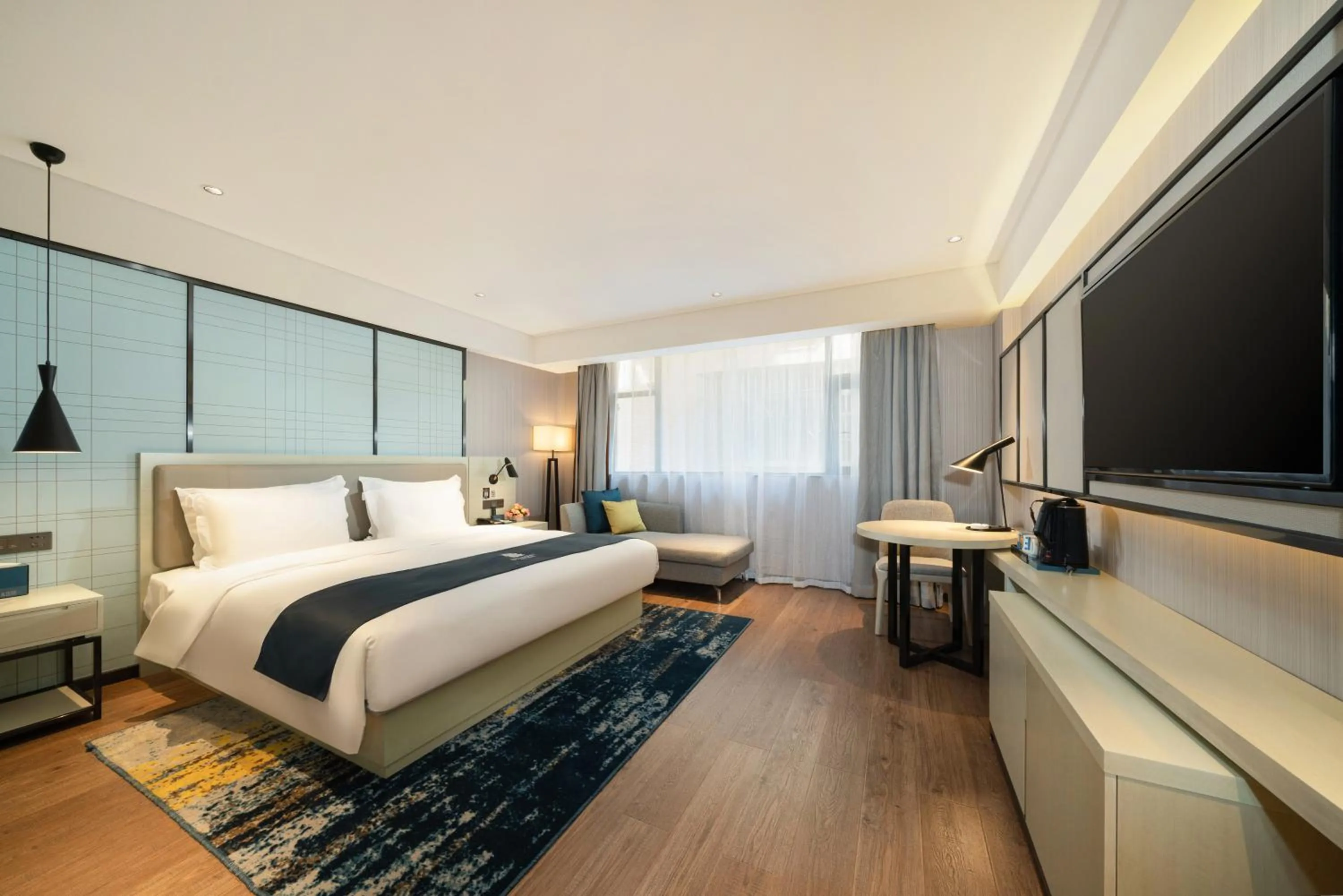 Bedroom, Bed in Echarm Hotel Wuzhou Canghai Lake High Speed Railway Station