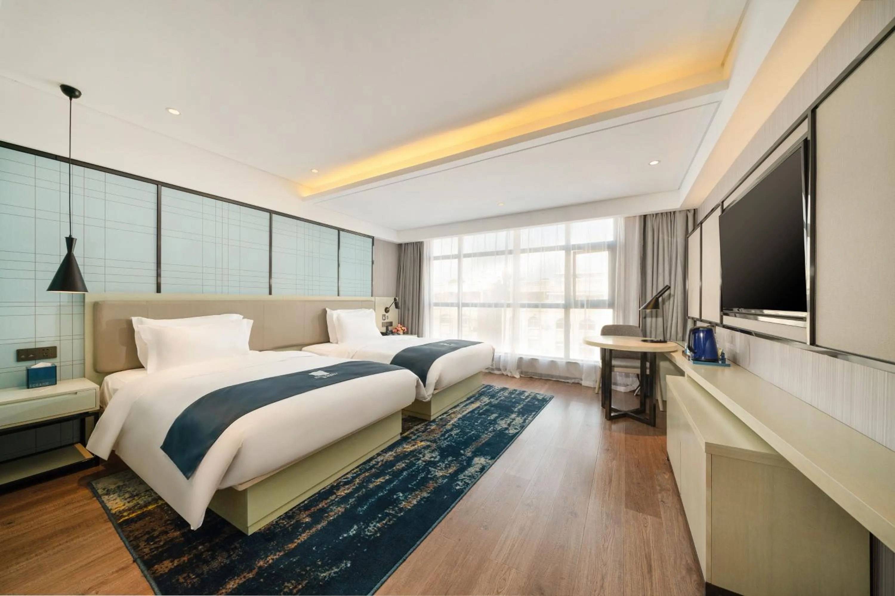 Bedroom, Bed in Echarm Hotel Wuzhou Canghai Lake High Speed Railway Station