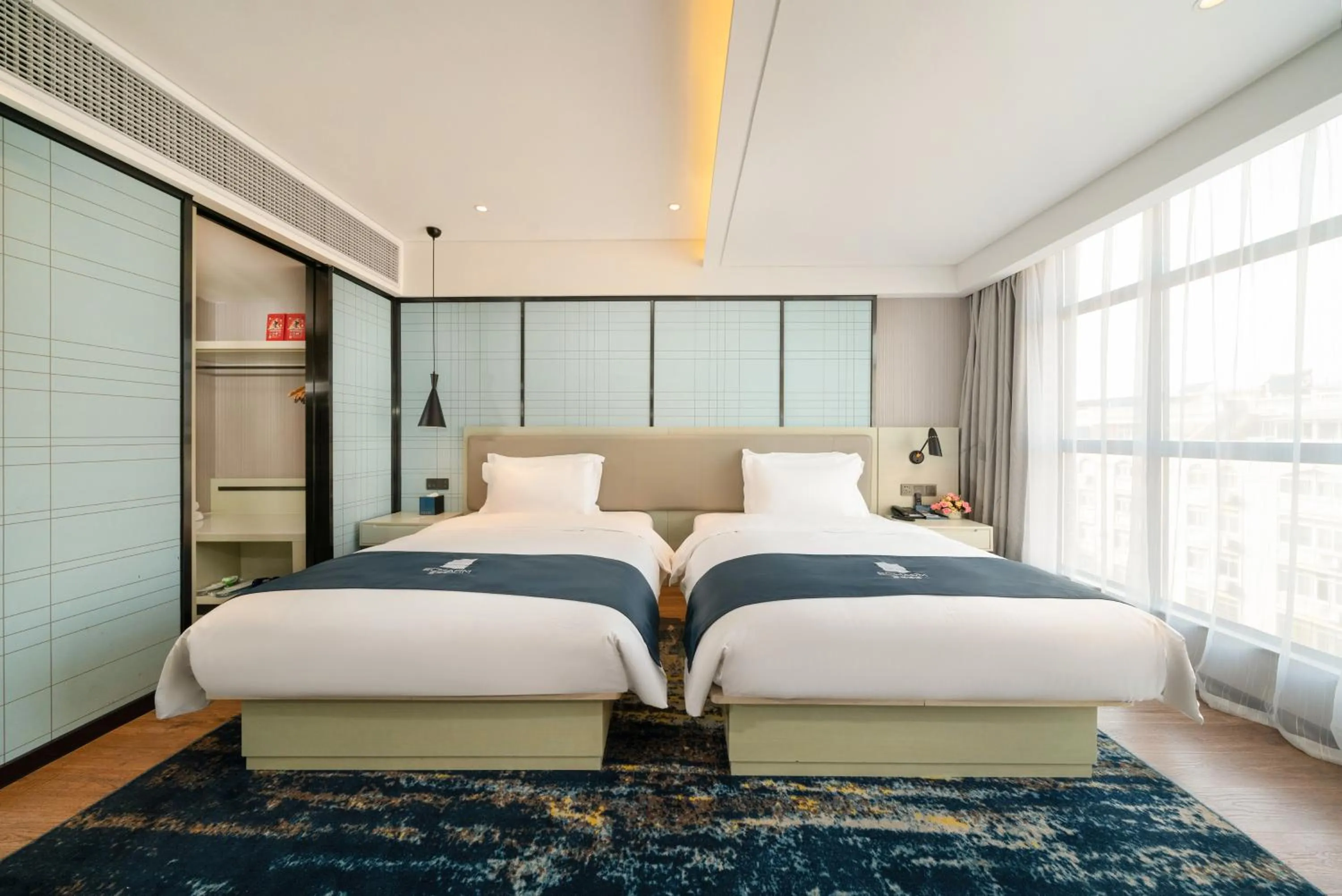 Bedroom, Bed in Echarm Hotel Wuzhou Canghai Lake High Speed Railway Station