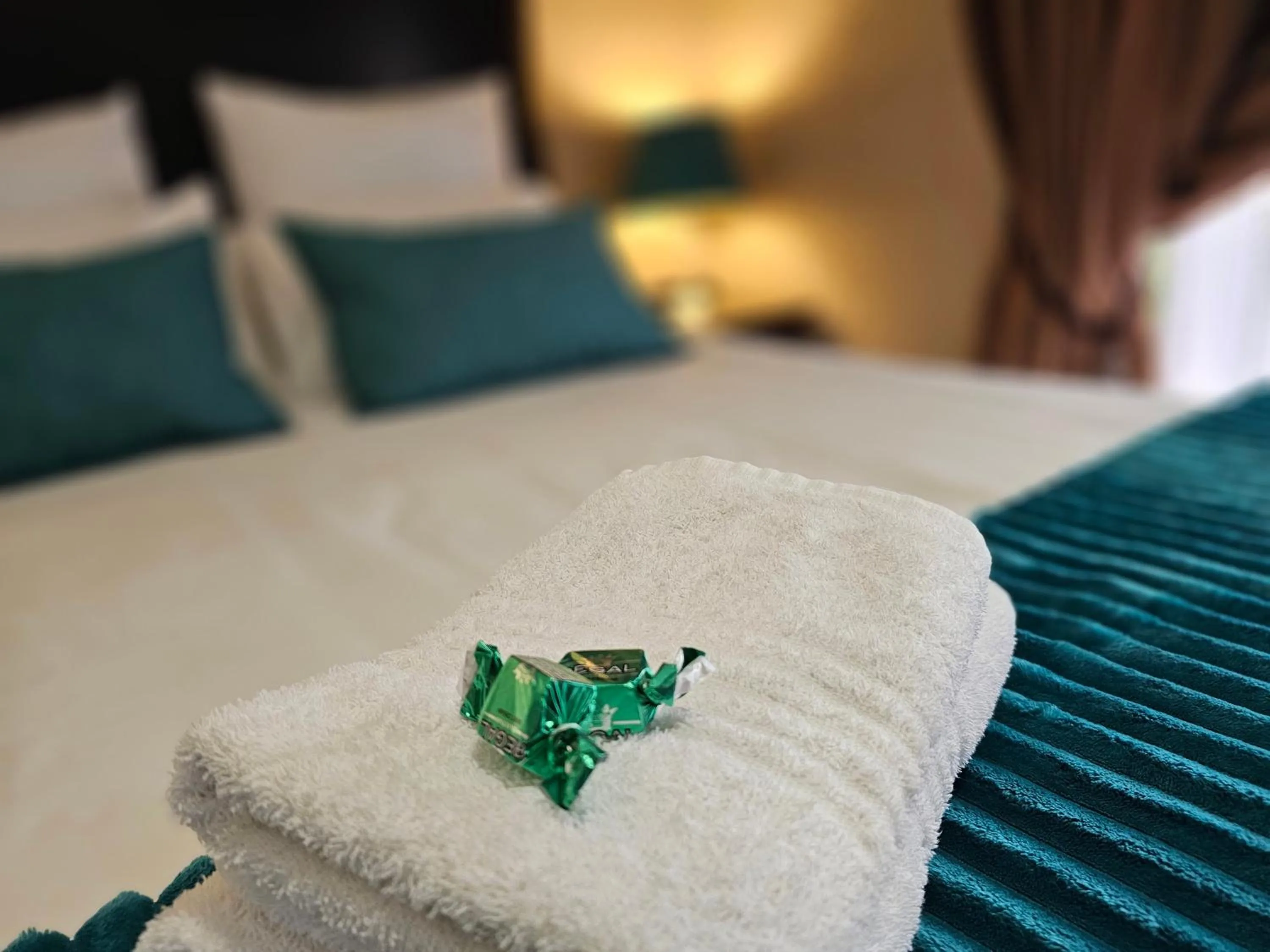 Bed in Bettie's Luxury Lodge