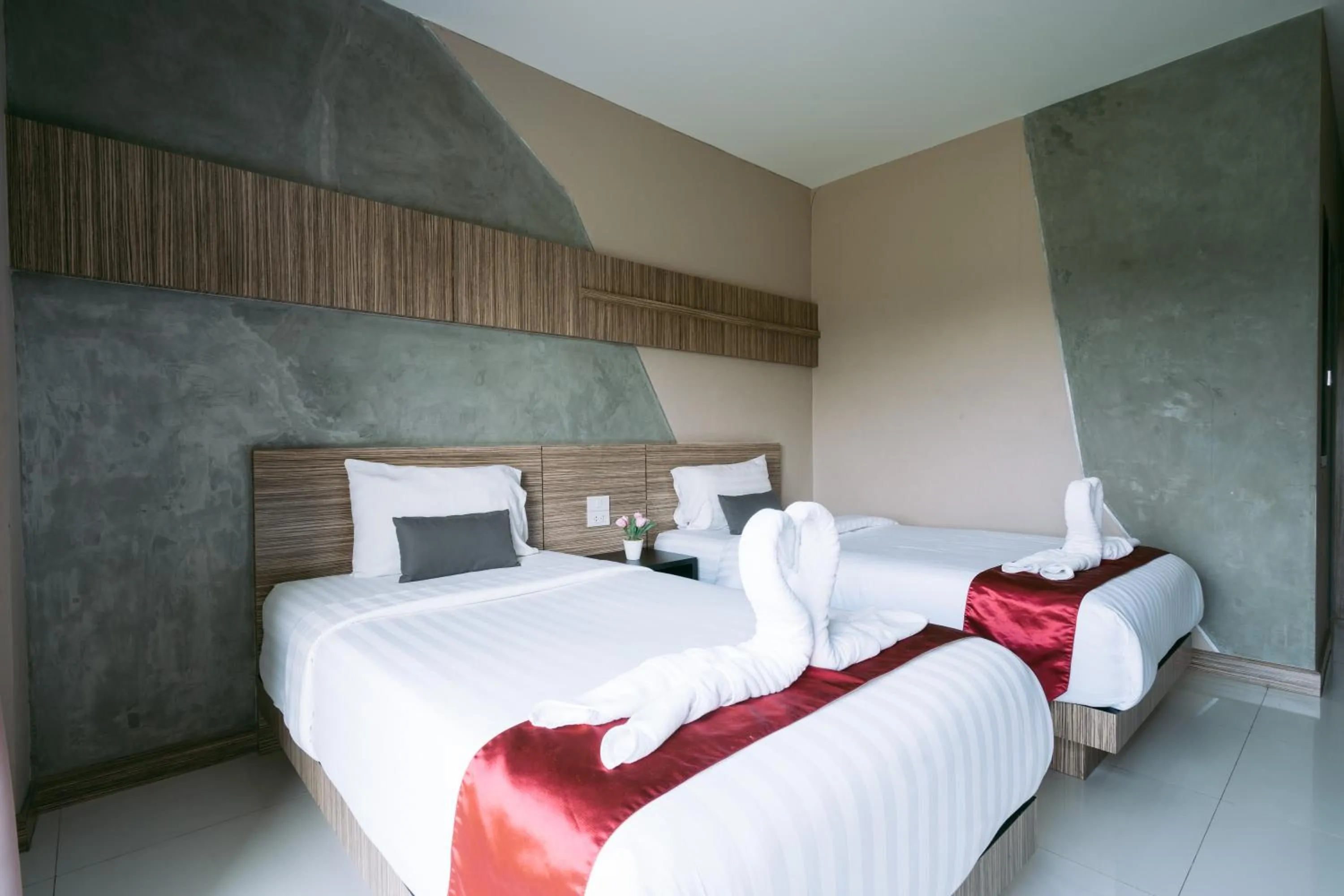 Bed in Ray Hotel Buriram