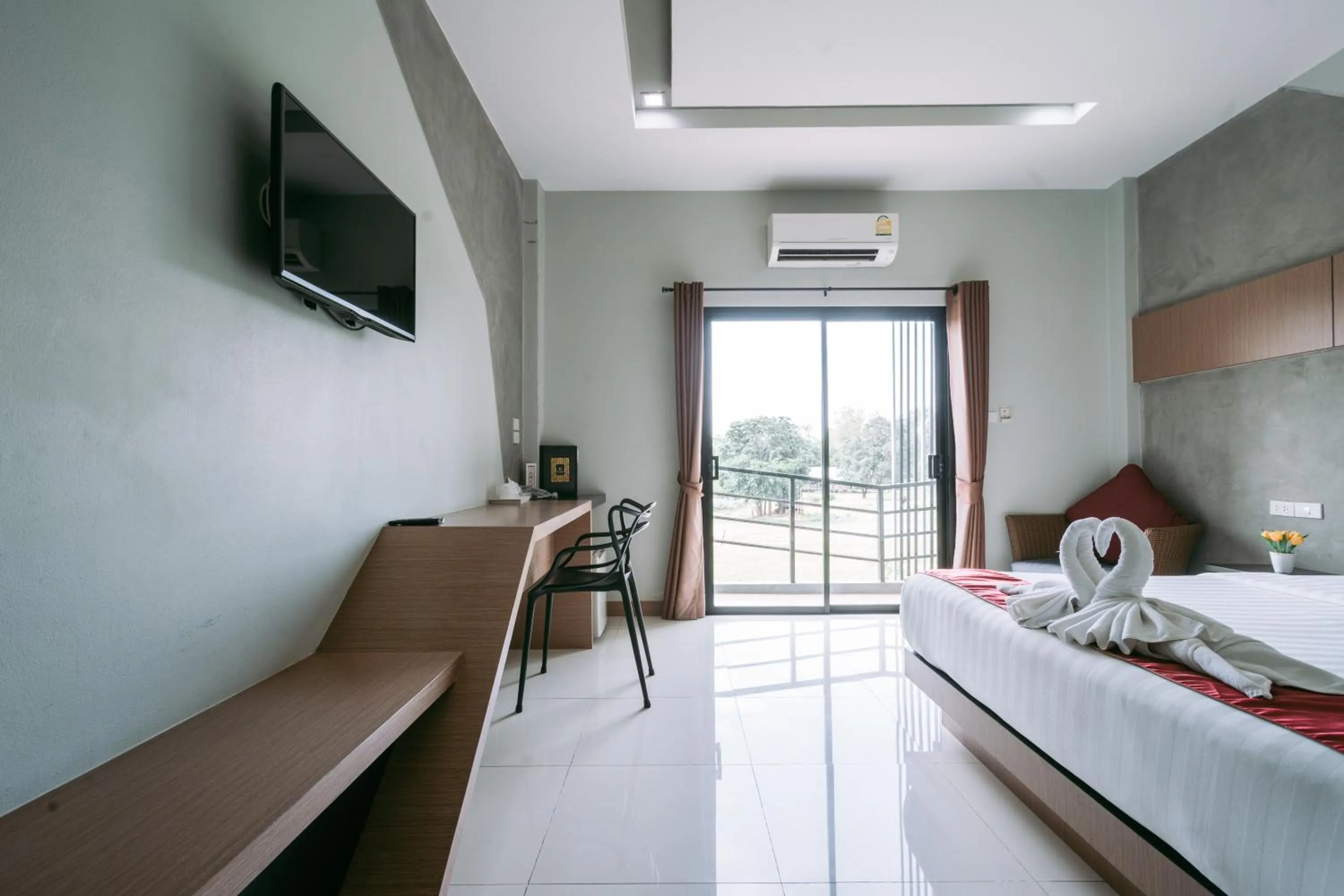 Photo of the whole room, Bed in Ray Hotel Buriram